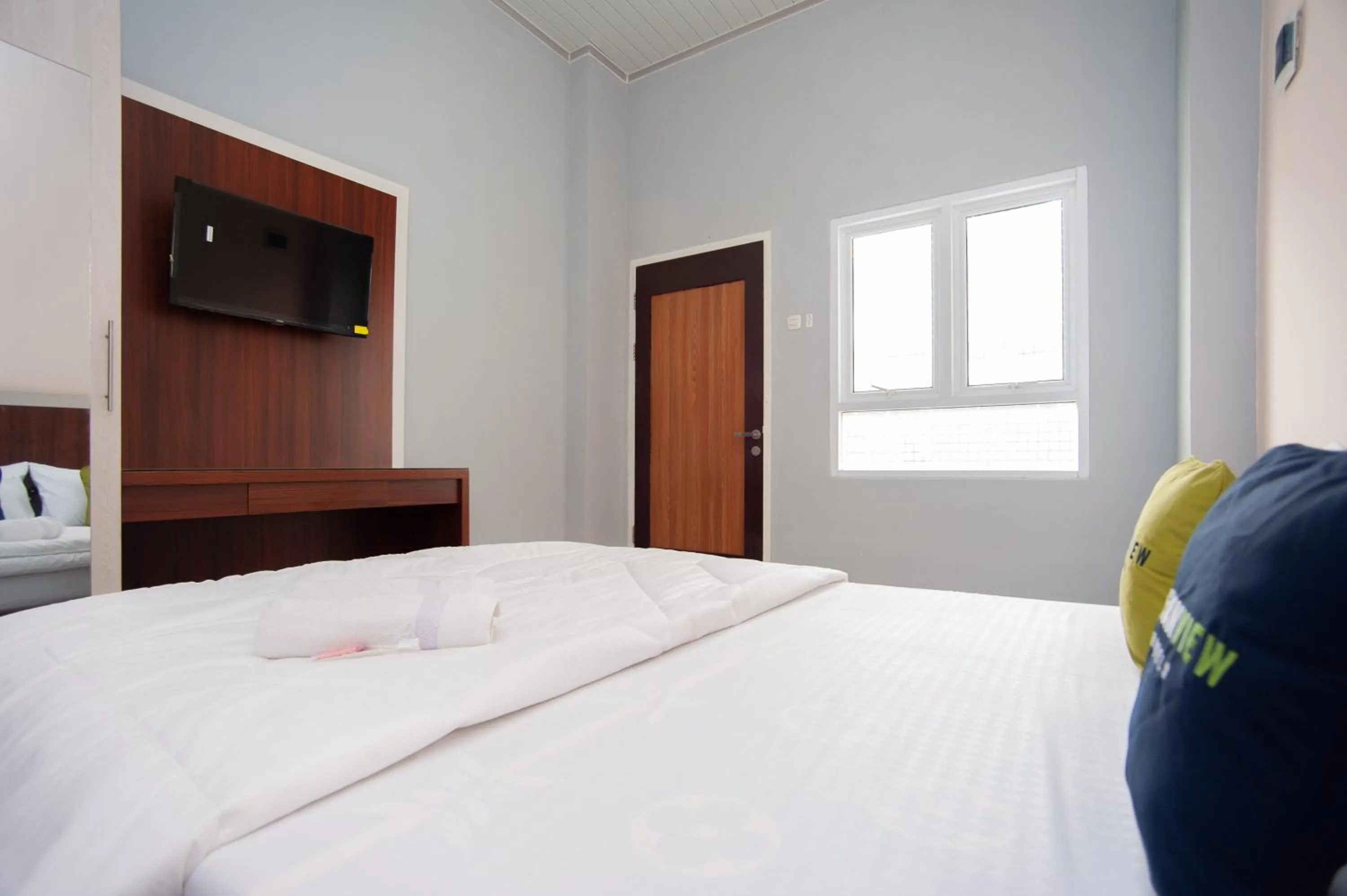 Bedroom, Bed in Urbanview Hotel Pangeran Palembang by RedDoorz
