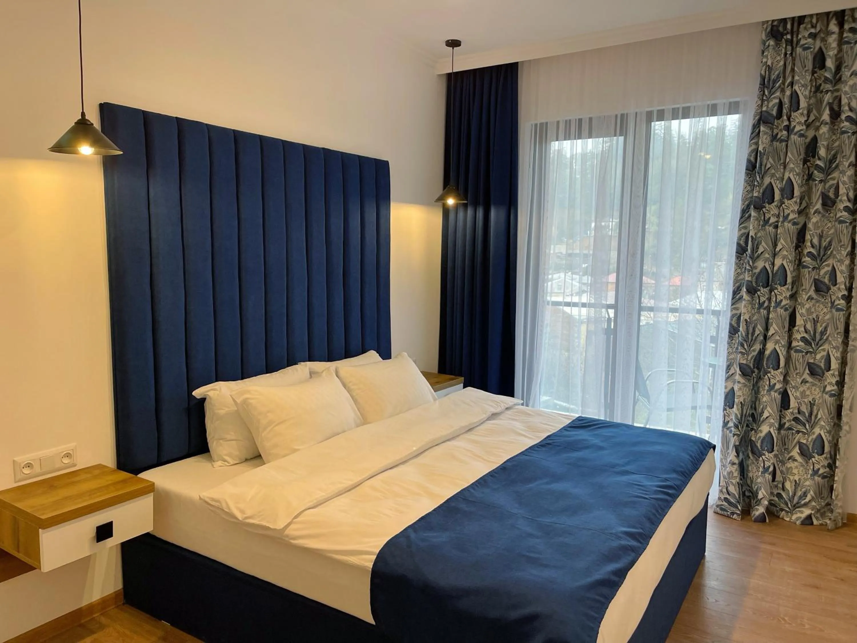 Bed in City Heart Luxury Apartment