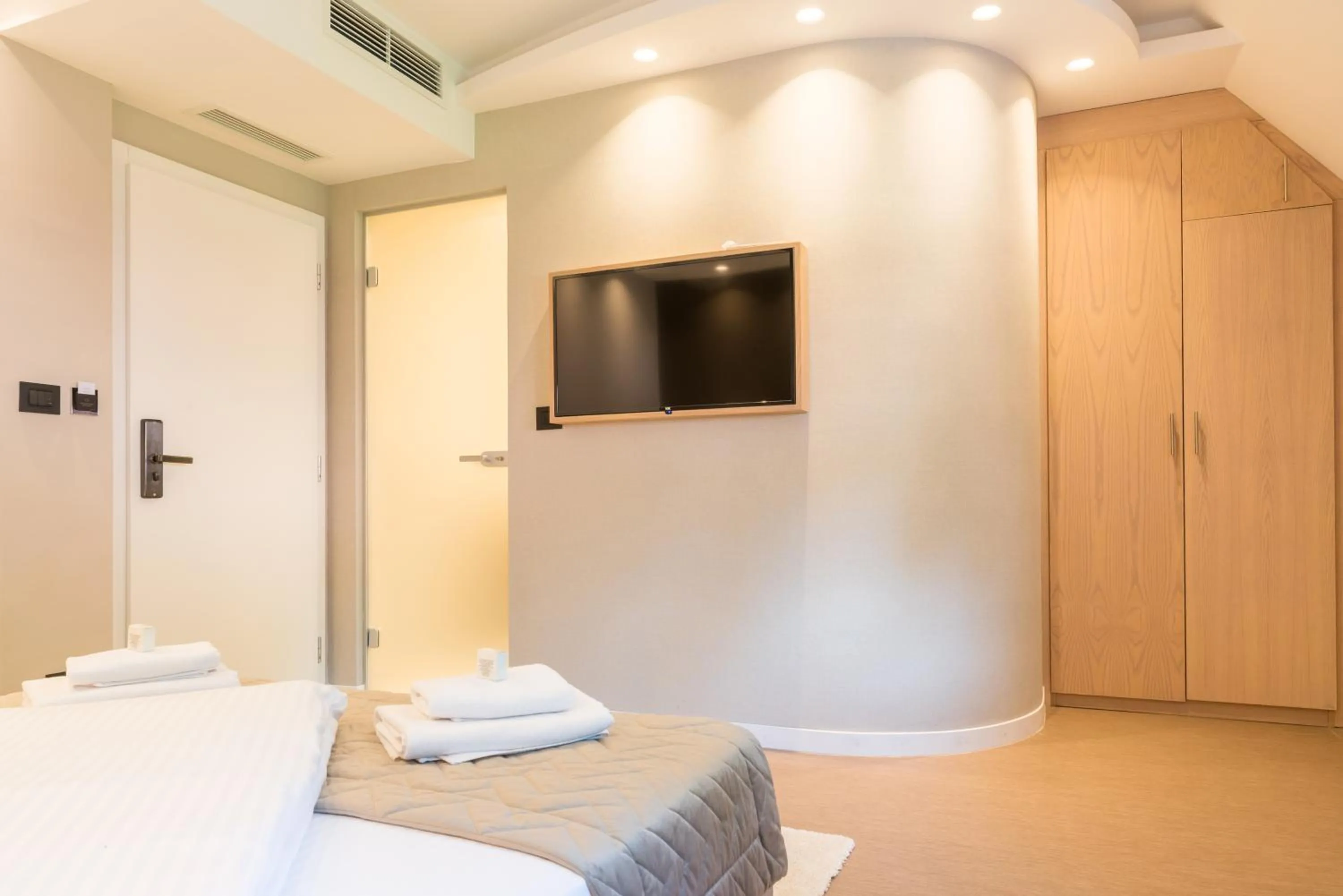 Bed in Emilia Lux Rooms