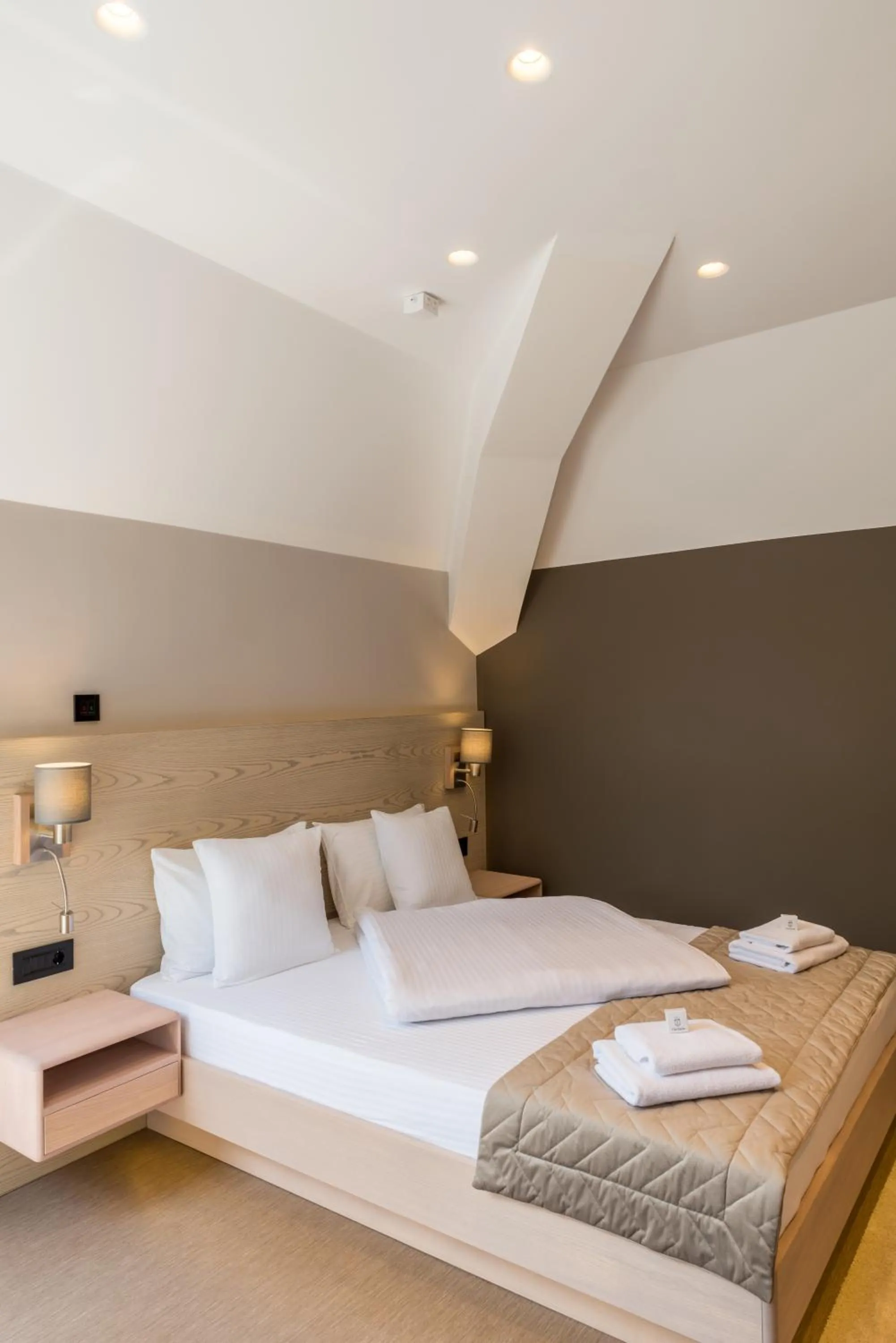 Bed in Emilia Lux Rooms