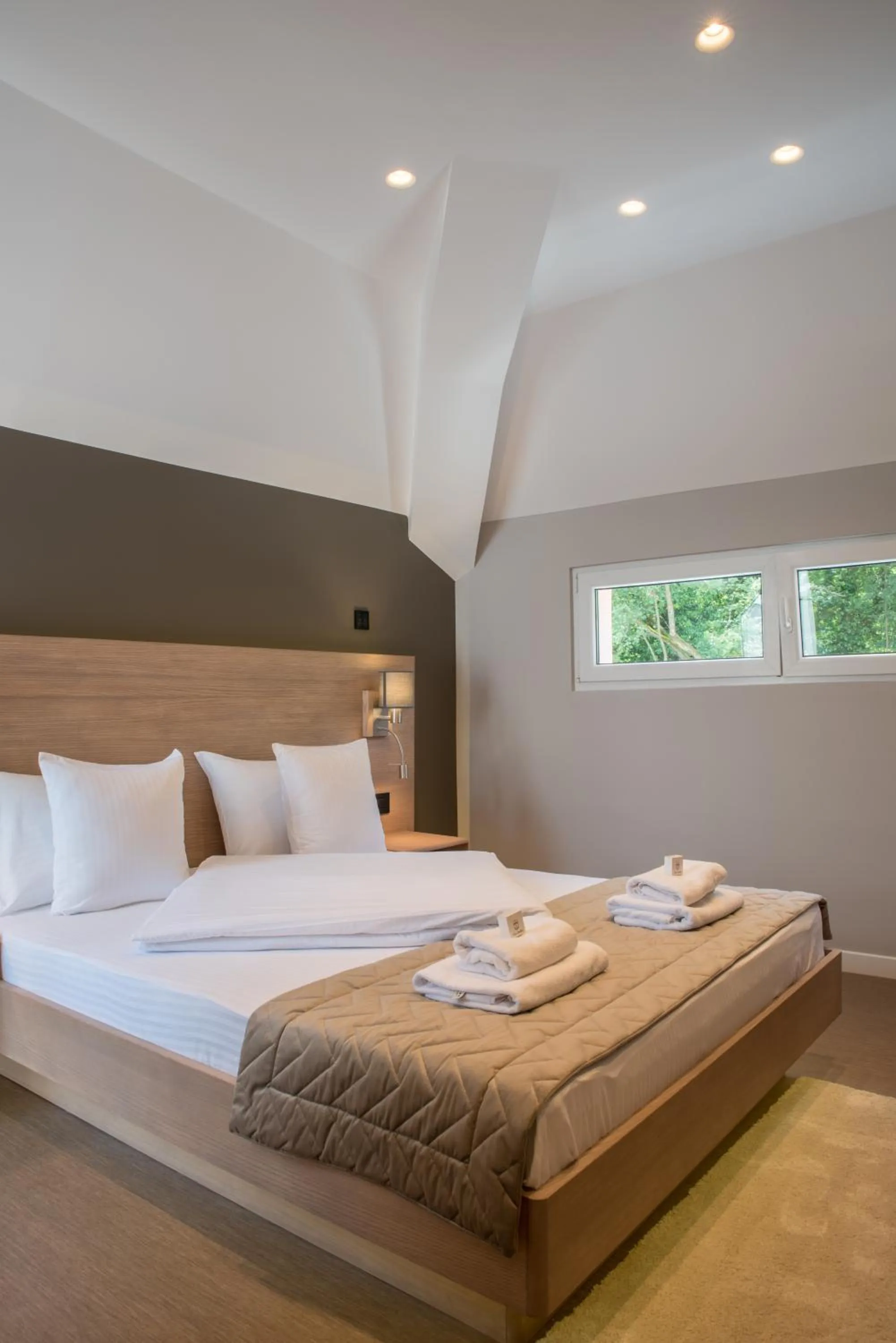 Bed in Emilia Lux Rooms