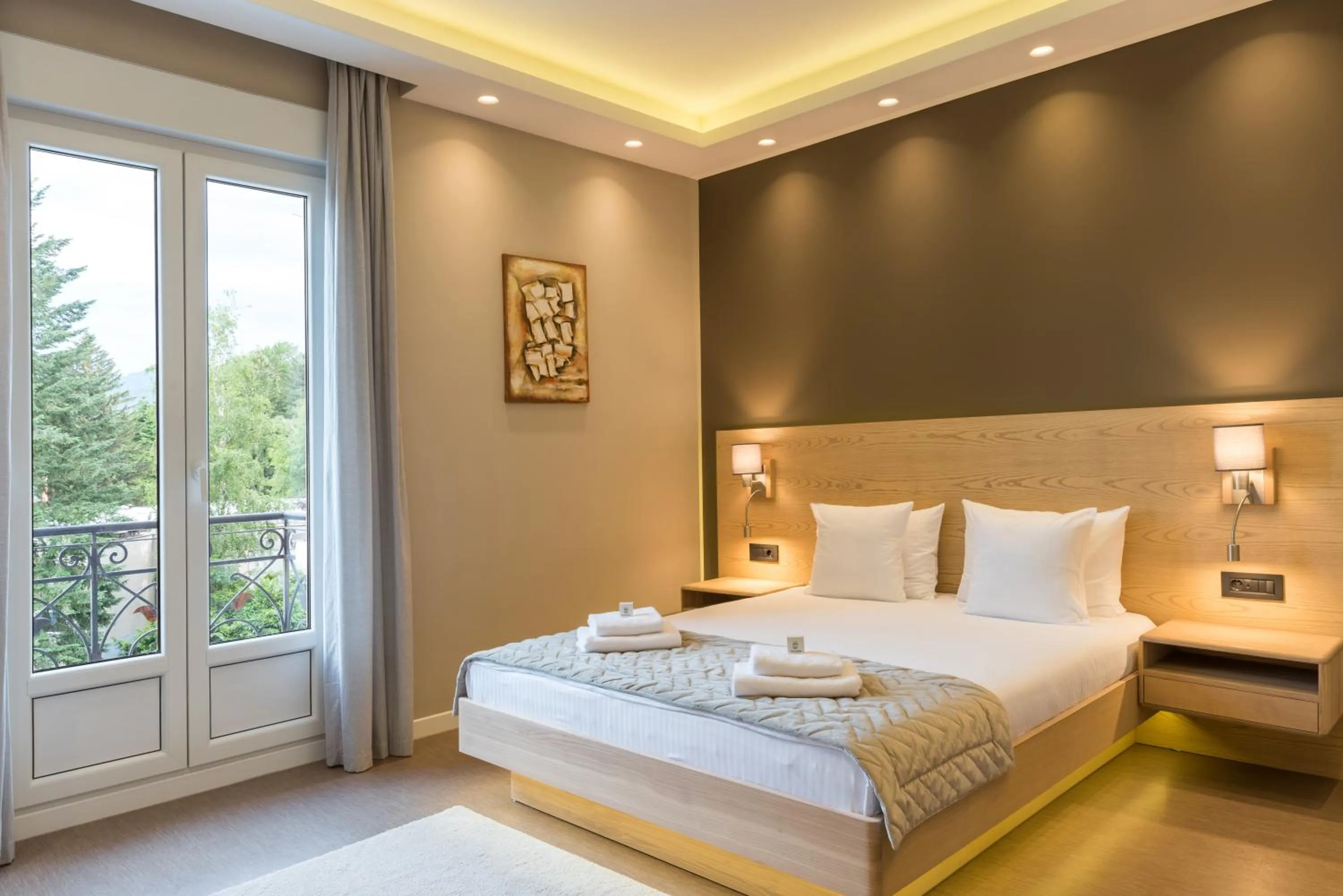 Bed in Emilia Lux Rooms