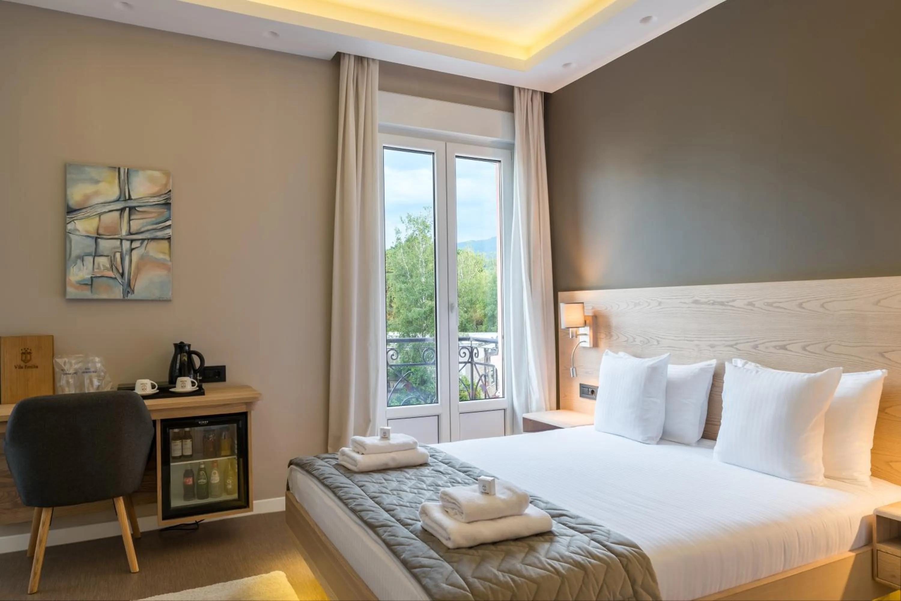 Bed in Emilia Lux Rooms