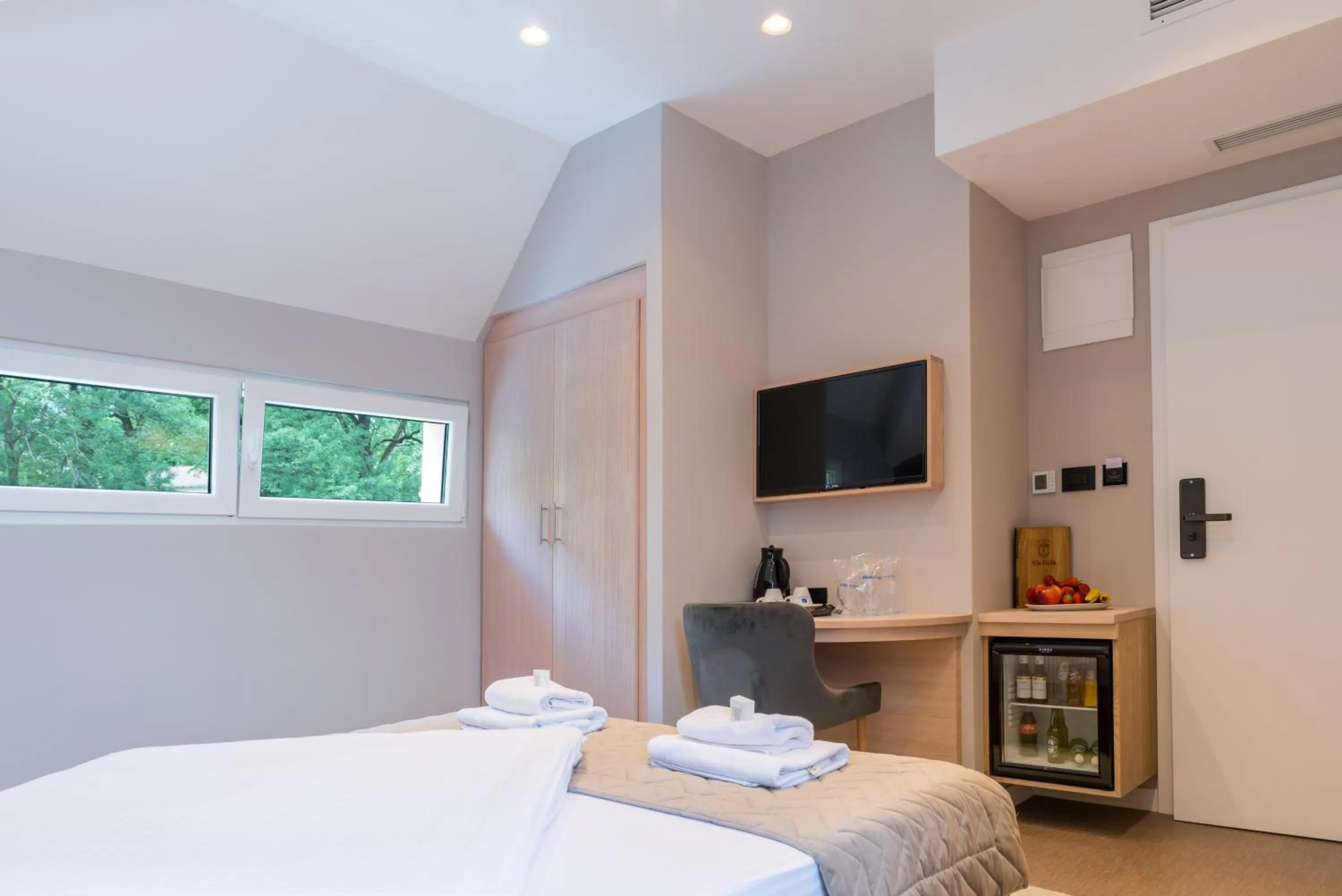 Bed in Emilia Lux Rooms