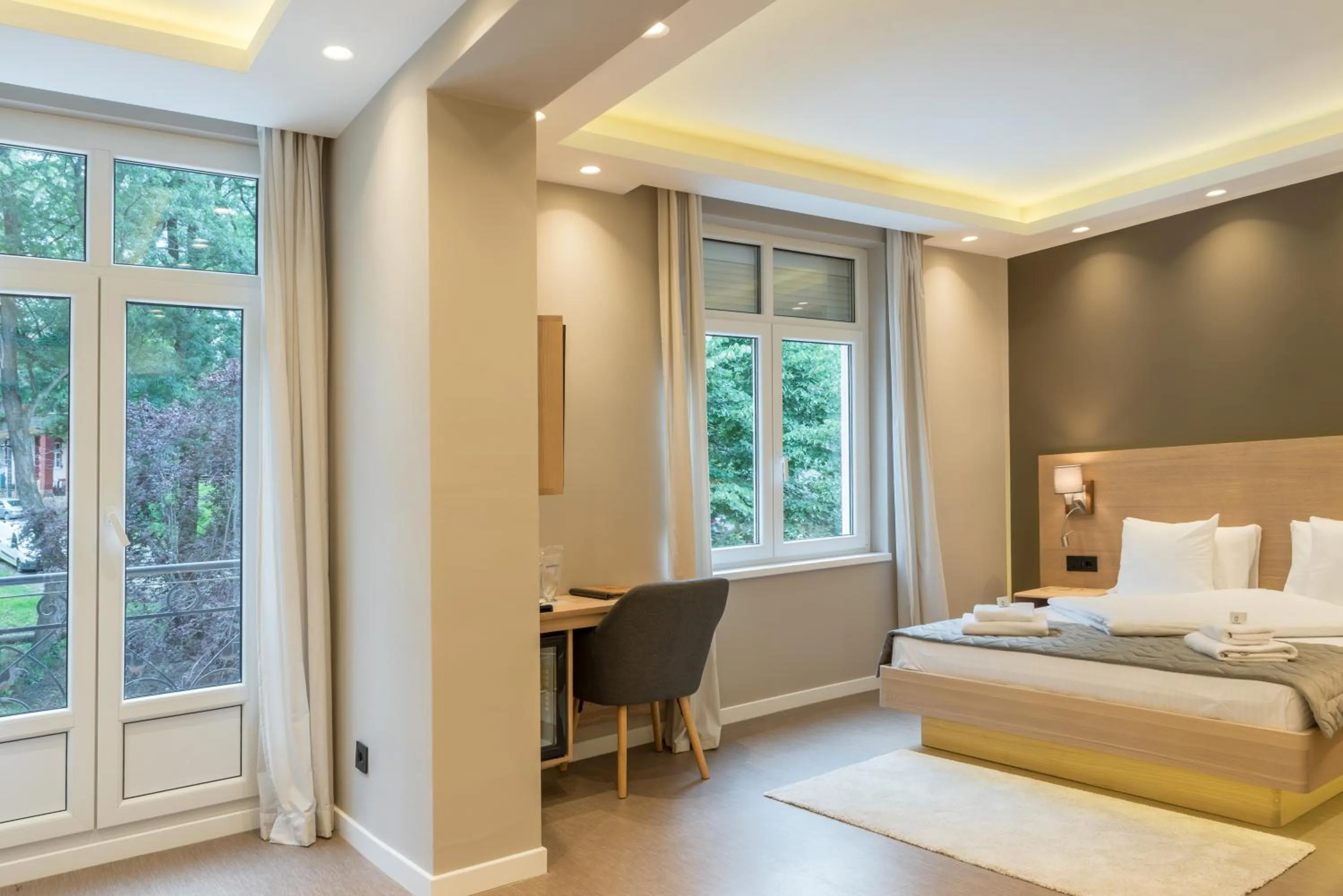 Bed in Emilia Lux Rooms