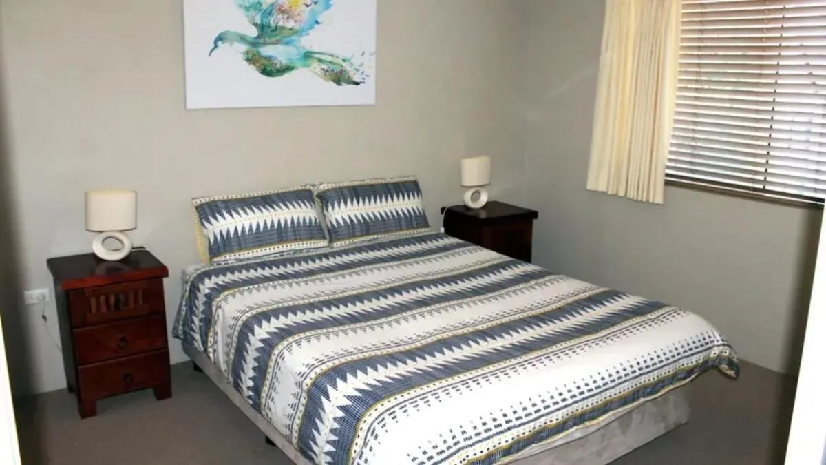 Bed in Paradise Grove Holiday Apartments