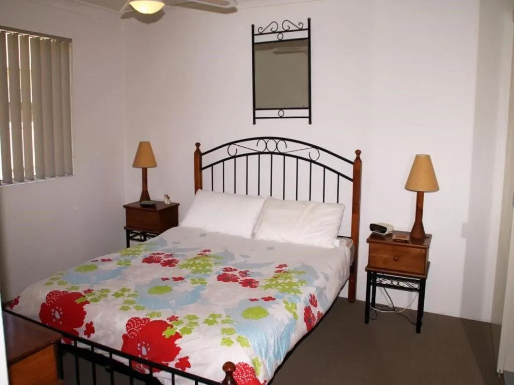 Bed in Paradise Grove Holiday Apartments