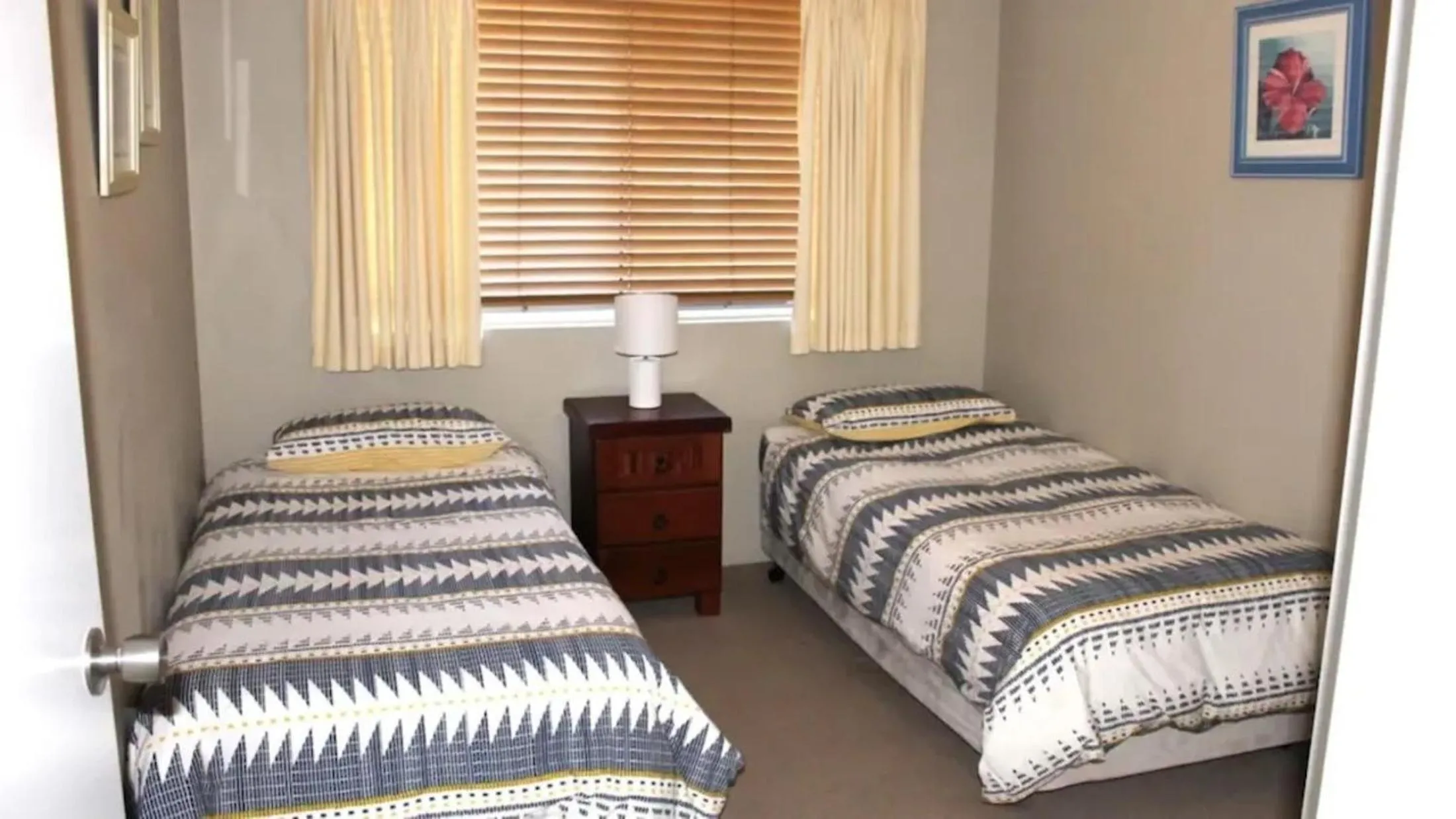 Bed in Paradise Grove Holiday Apartments
