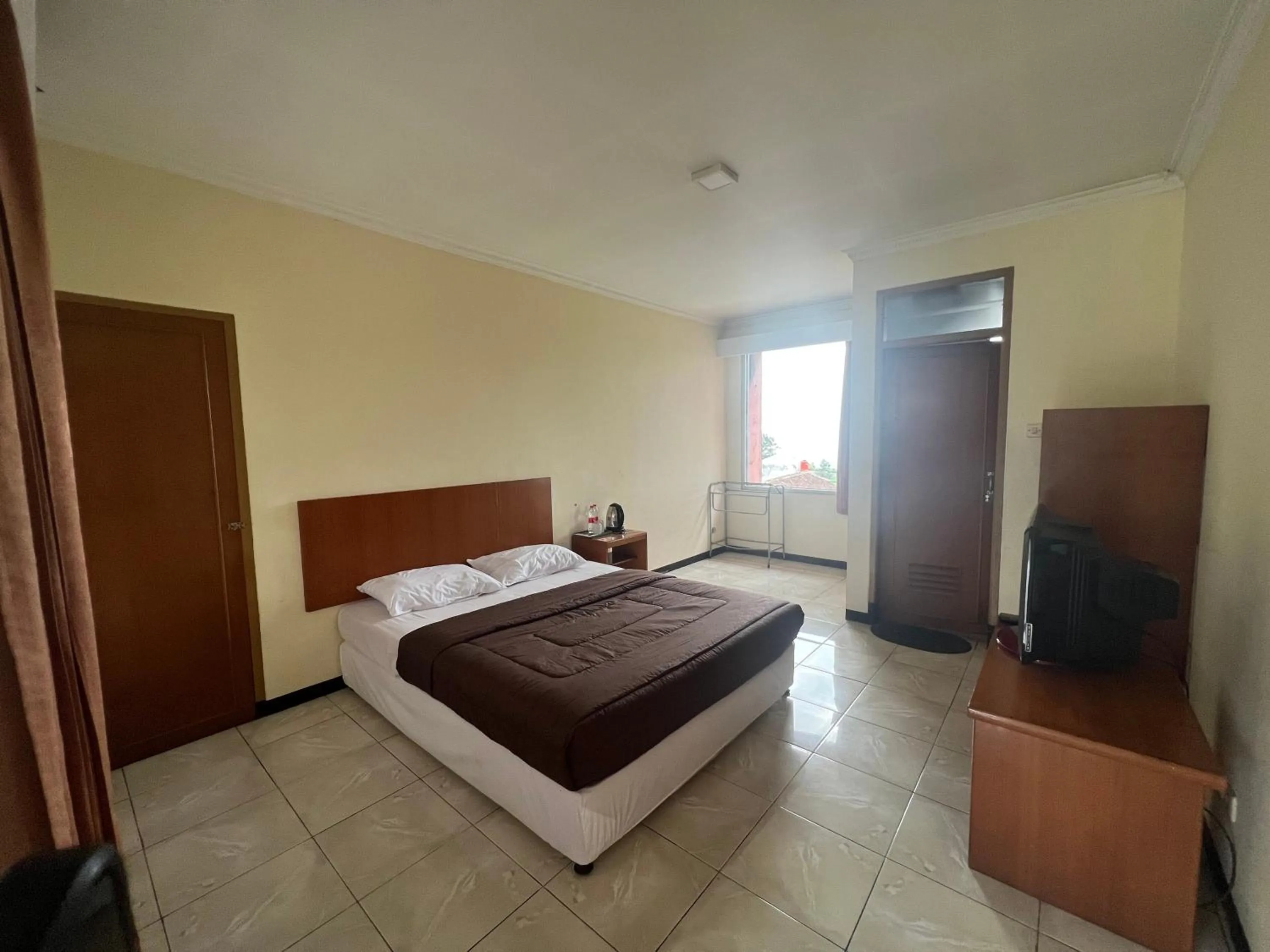 Bed in Hotel Puspa Sari