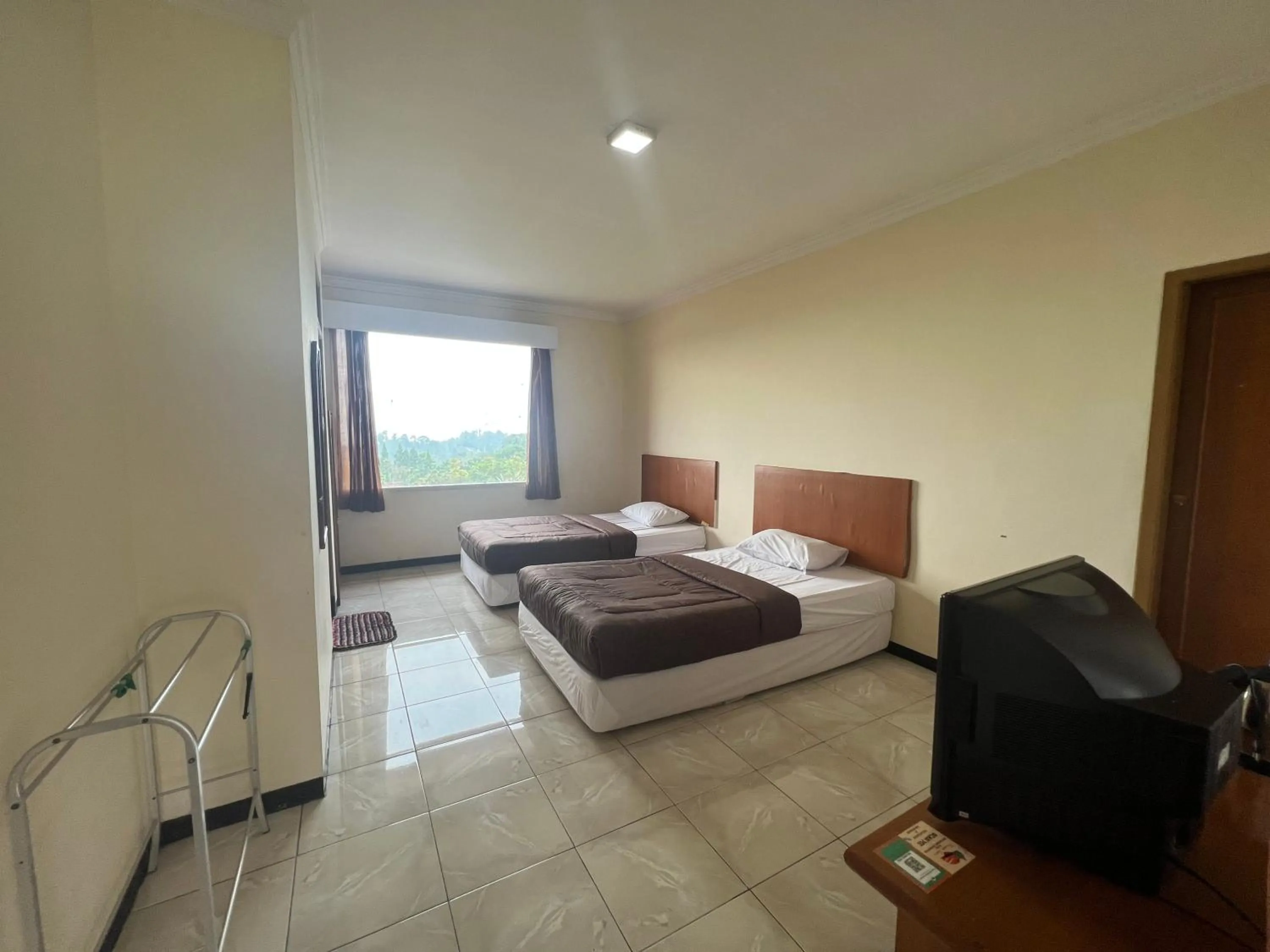 Bed in Hotel Puspa Sari