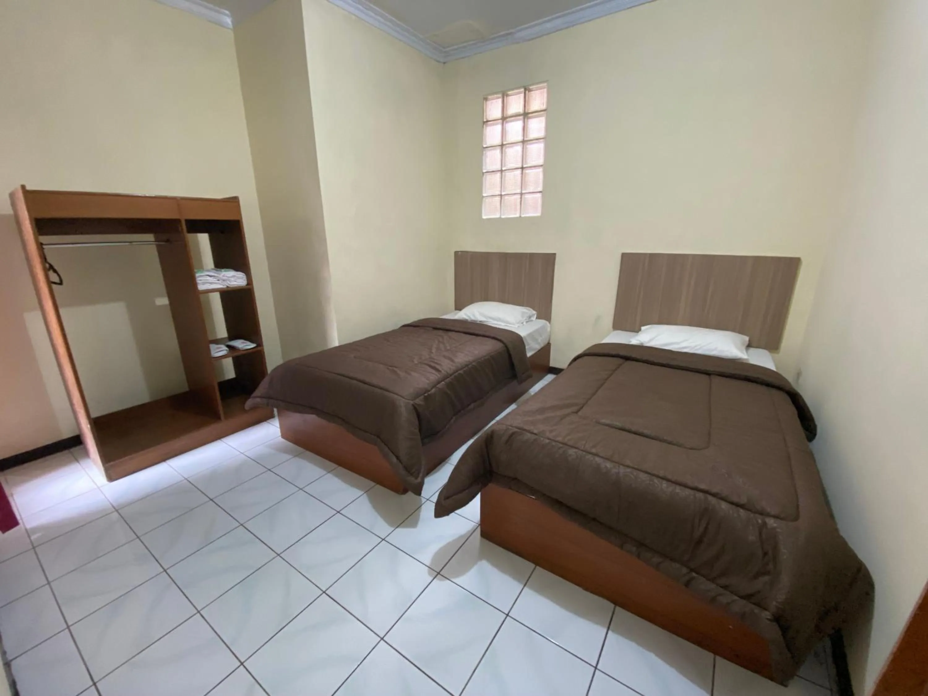 Bed in Hotel Puspa Sari