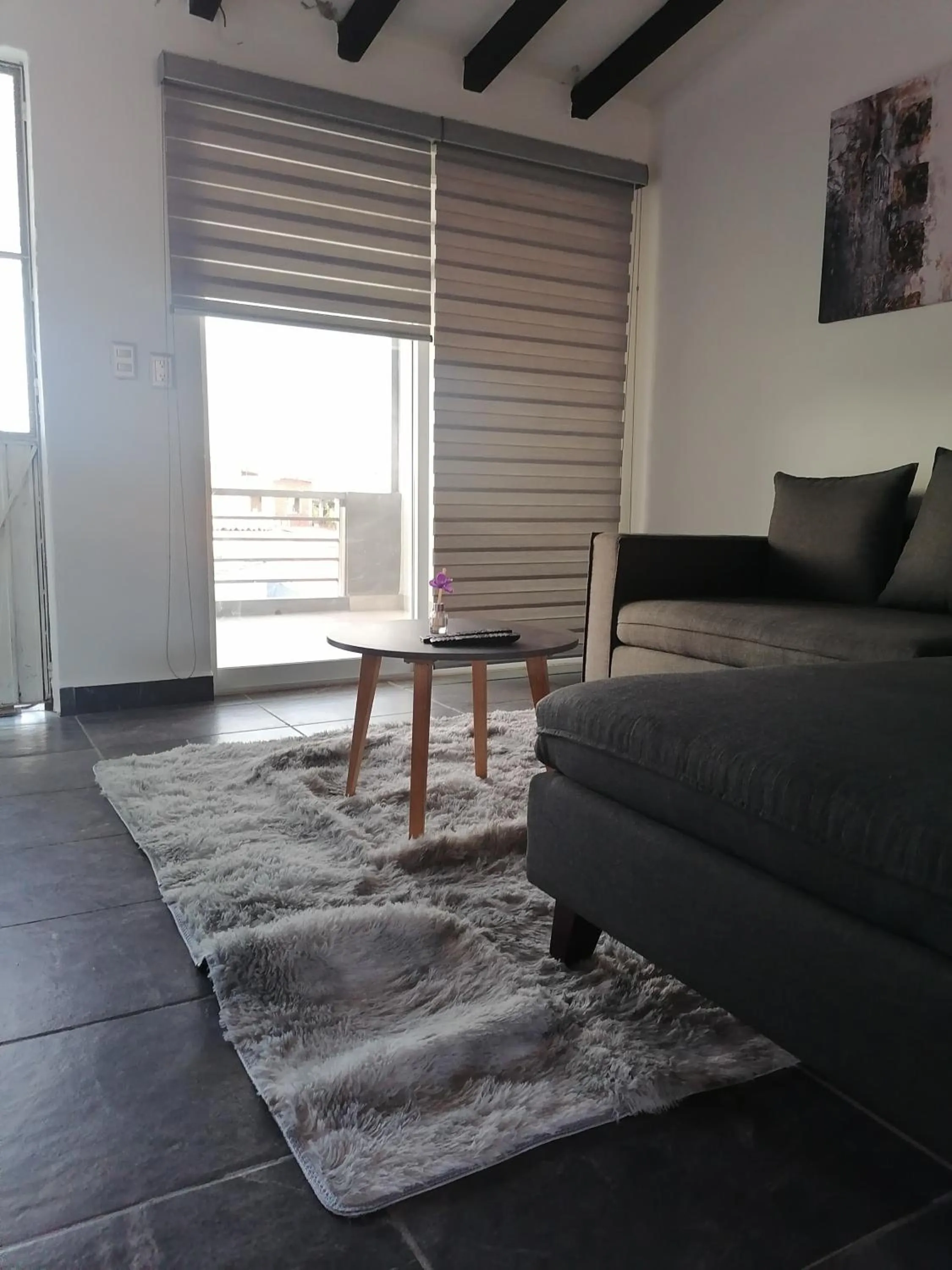 Communal lounge/ TV room in Camberos Place - centrally-located loft-penthouse