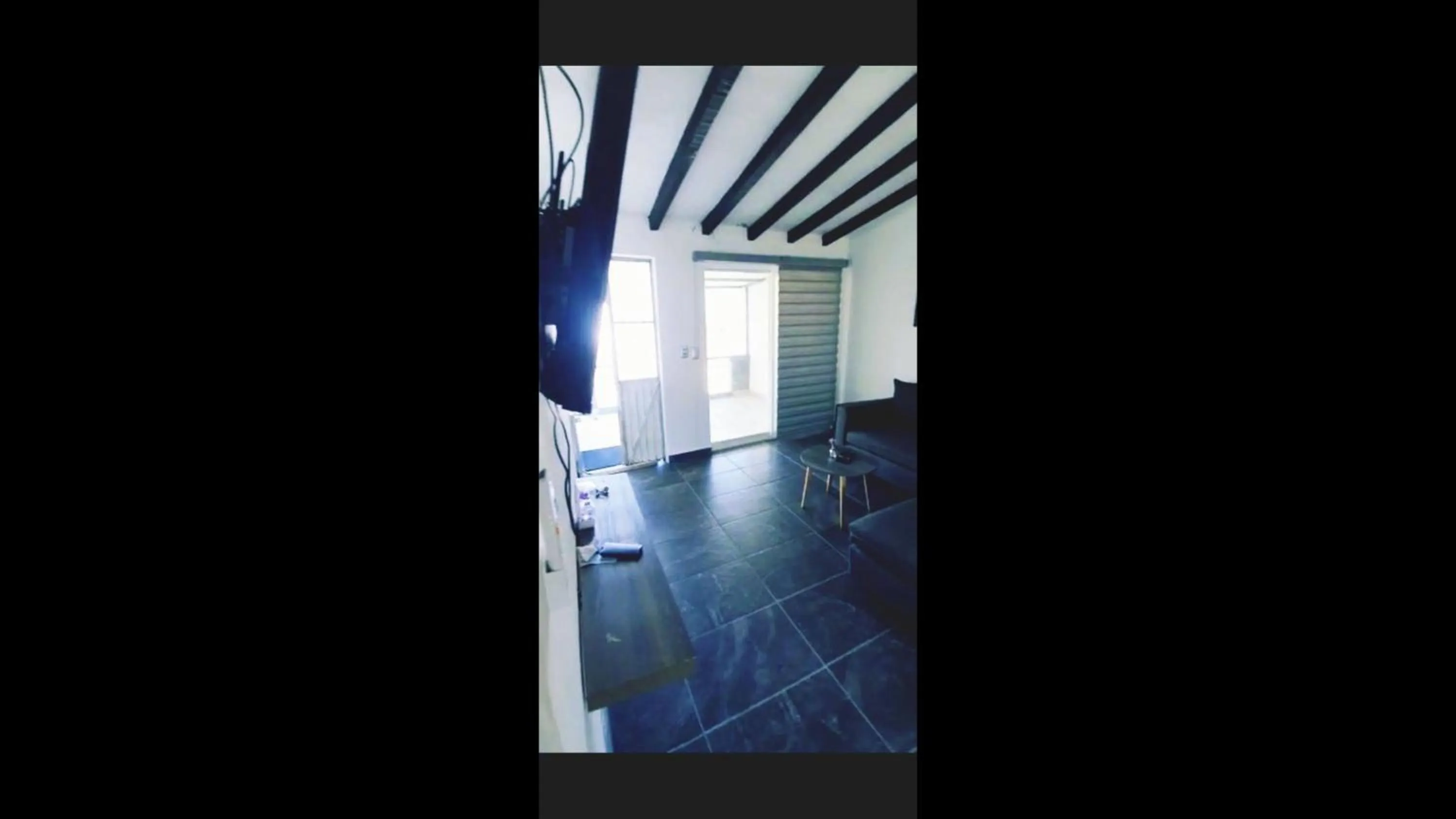 Communal lounge/ TV room in Camberos Place - centrally-located loft-penthouse