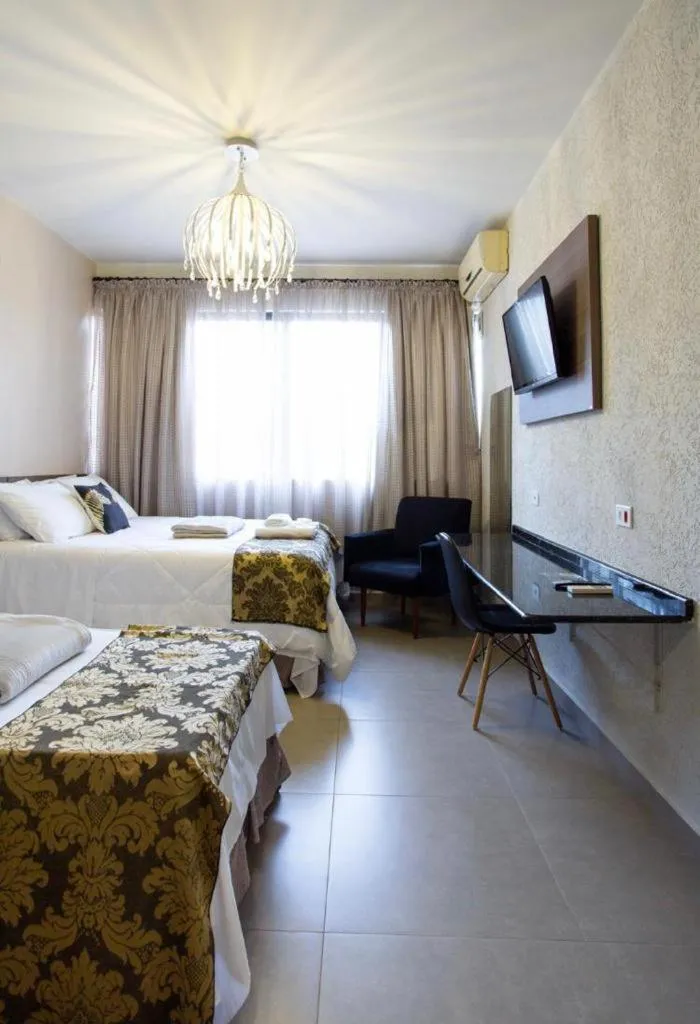 Communal lounge/ TV room, Bed in HOTEL PIACENTINI