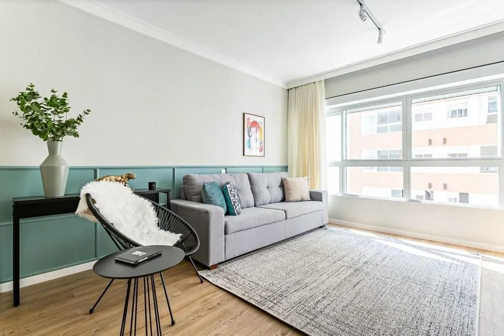 Living room in K-Platz 406 - Studio Elegante e Moderno na Melhor Localização do Continente