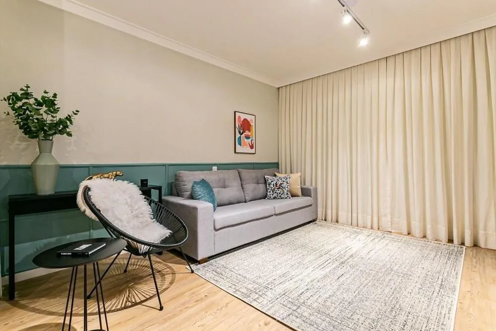 Living room in K-Platz 406 - Studio Elegante e Moderno na Melhor Localização do Continente