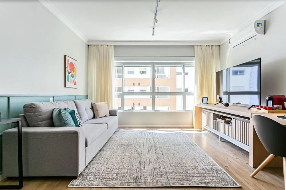 Living room in K-Platz 406 - Studio Elegante e Moderno na Melhor Localização do Continente