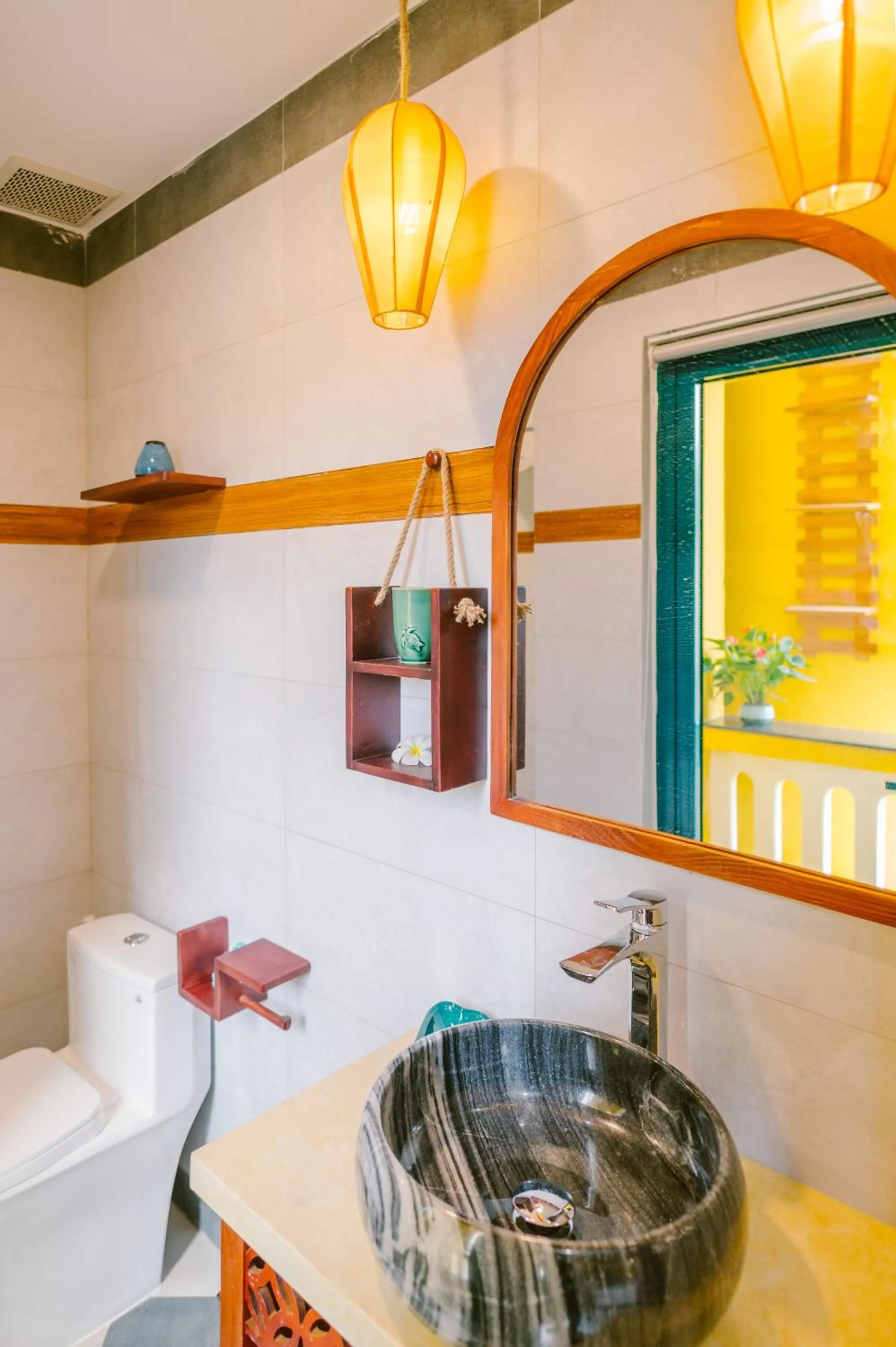 Bathroom in De'Colore Villa Hoi An
