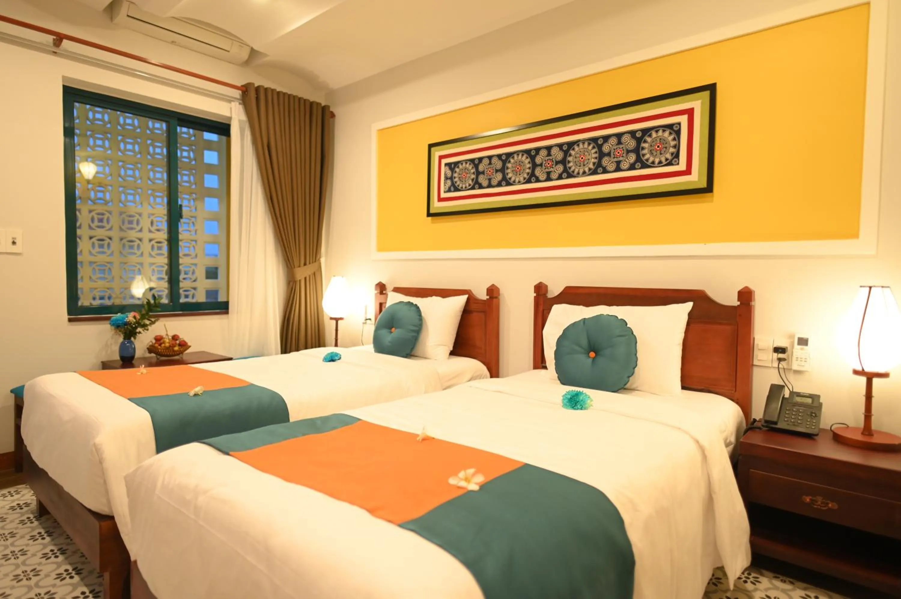 Bed in De'Colore Villa Hoi An