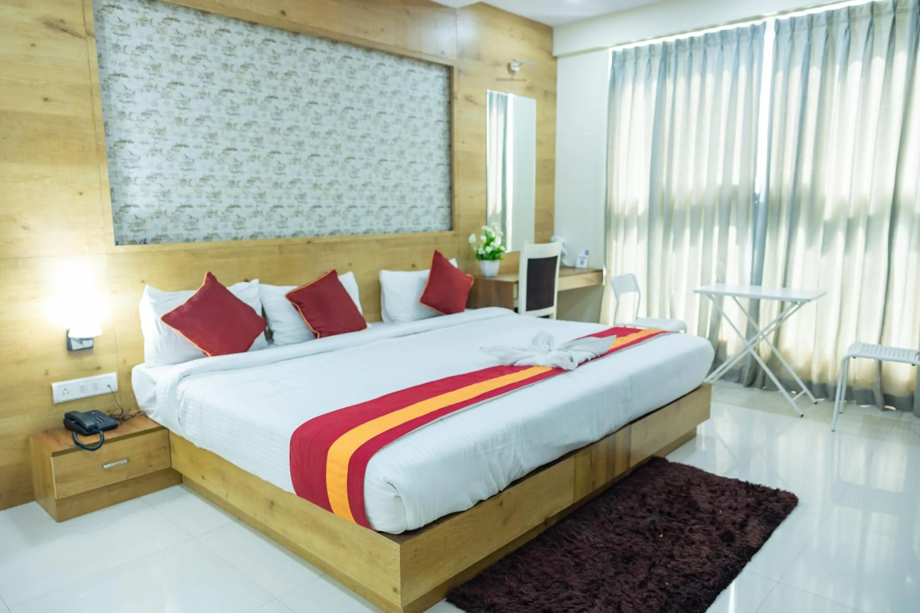 Bed in Ishwerya Suites