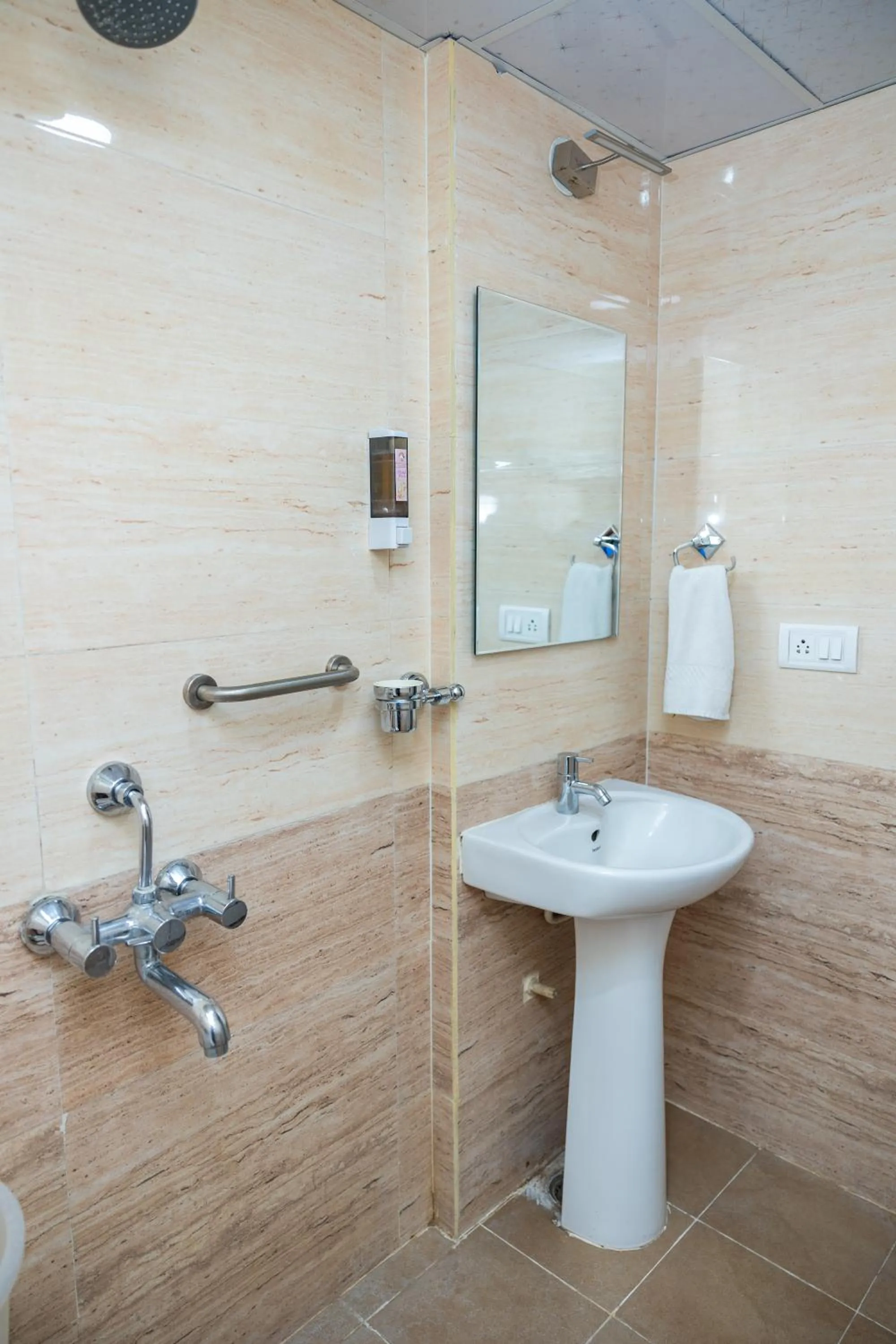 Bathroom in Ishwerya Suites