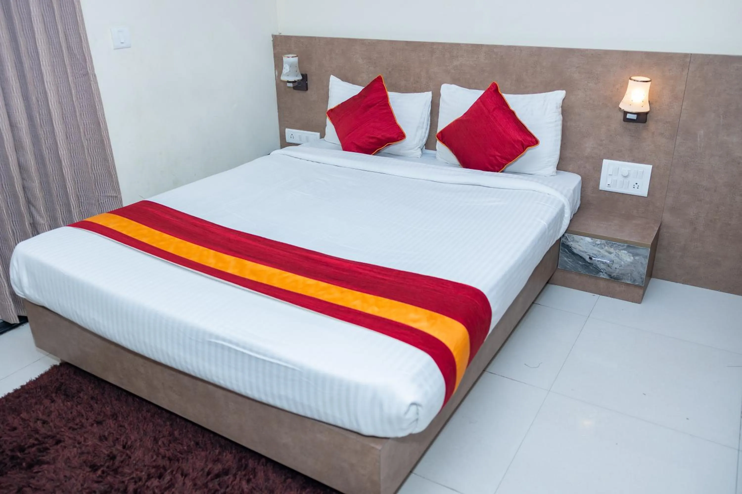 Bed in Ishwerya Suites