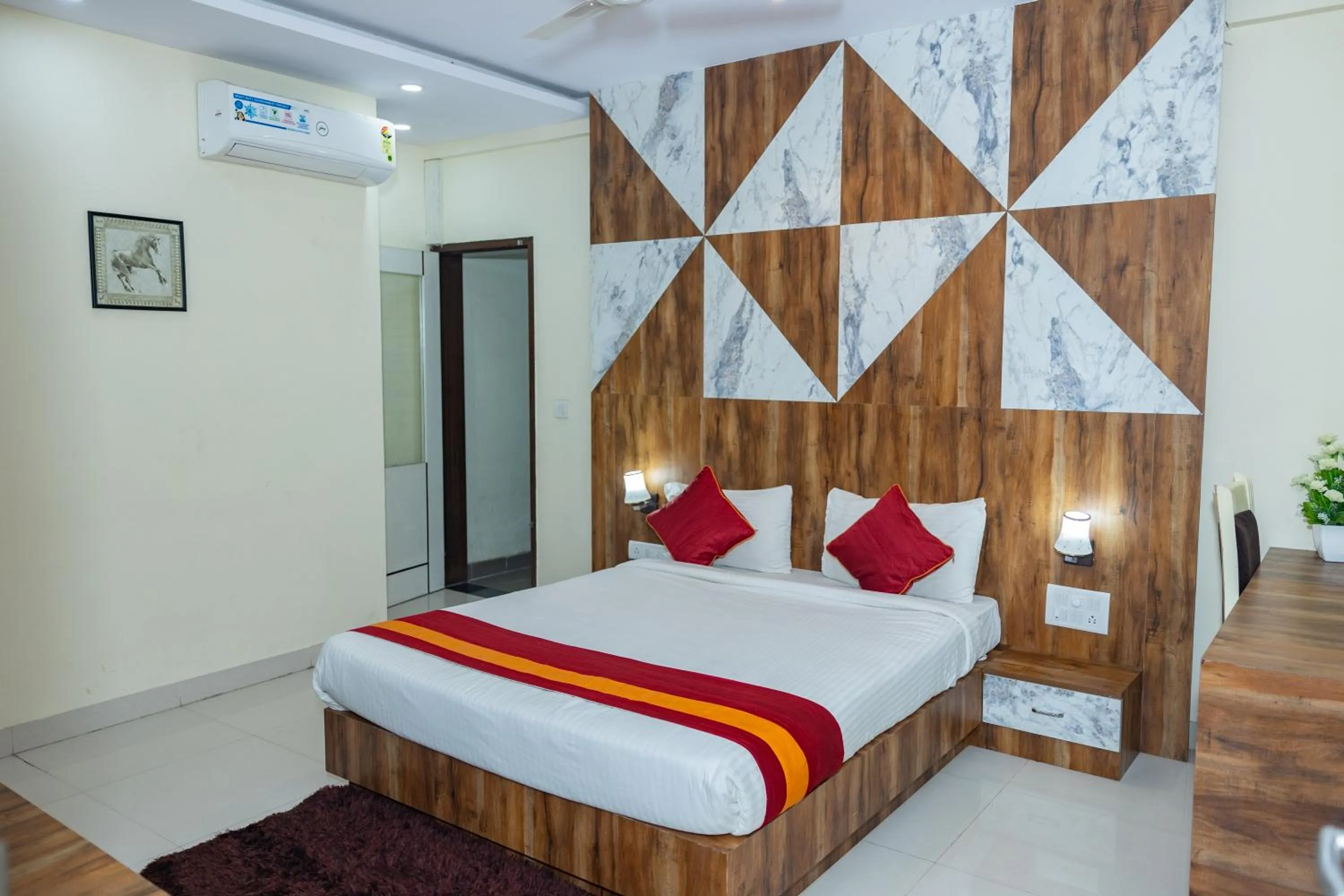 Bed in Ishwerya Suites