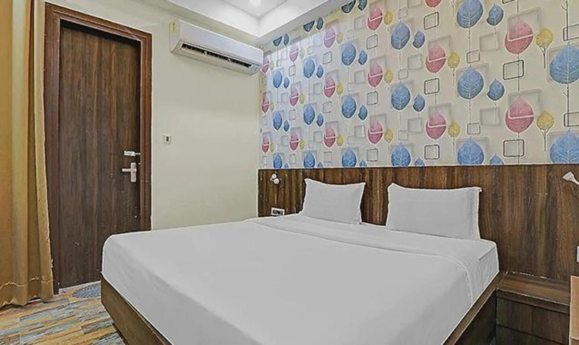 Bed in FabHotel Sam Inn