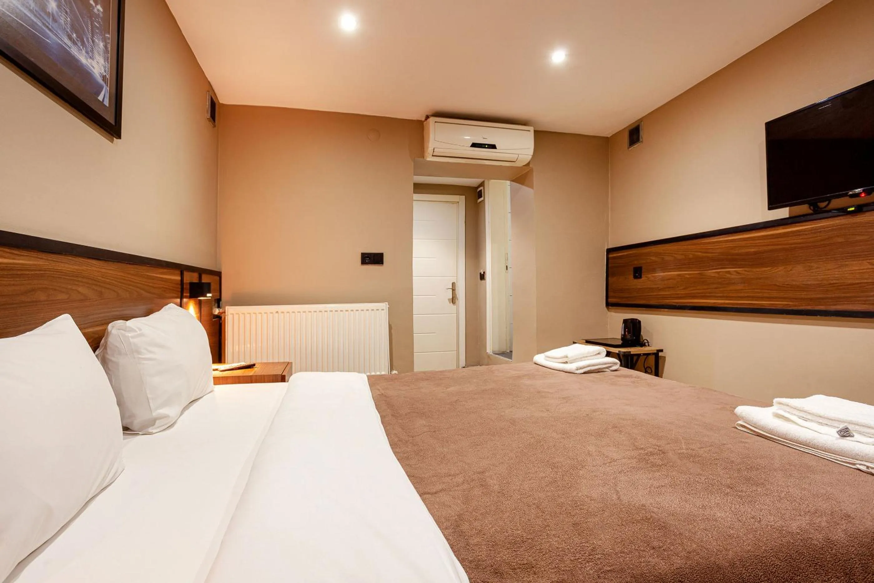 Bed in Aram Kerasi Rooms