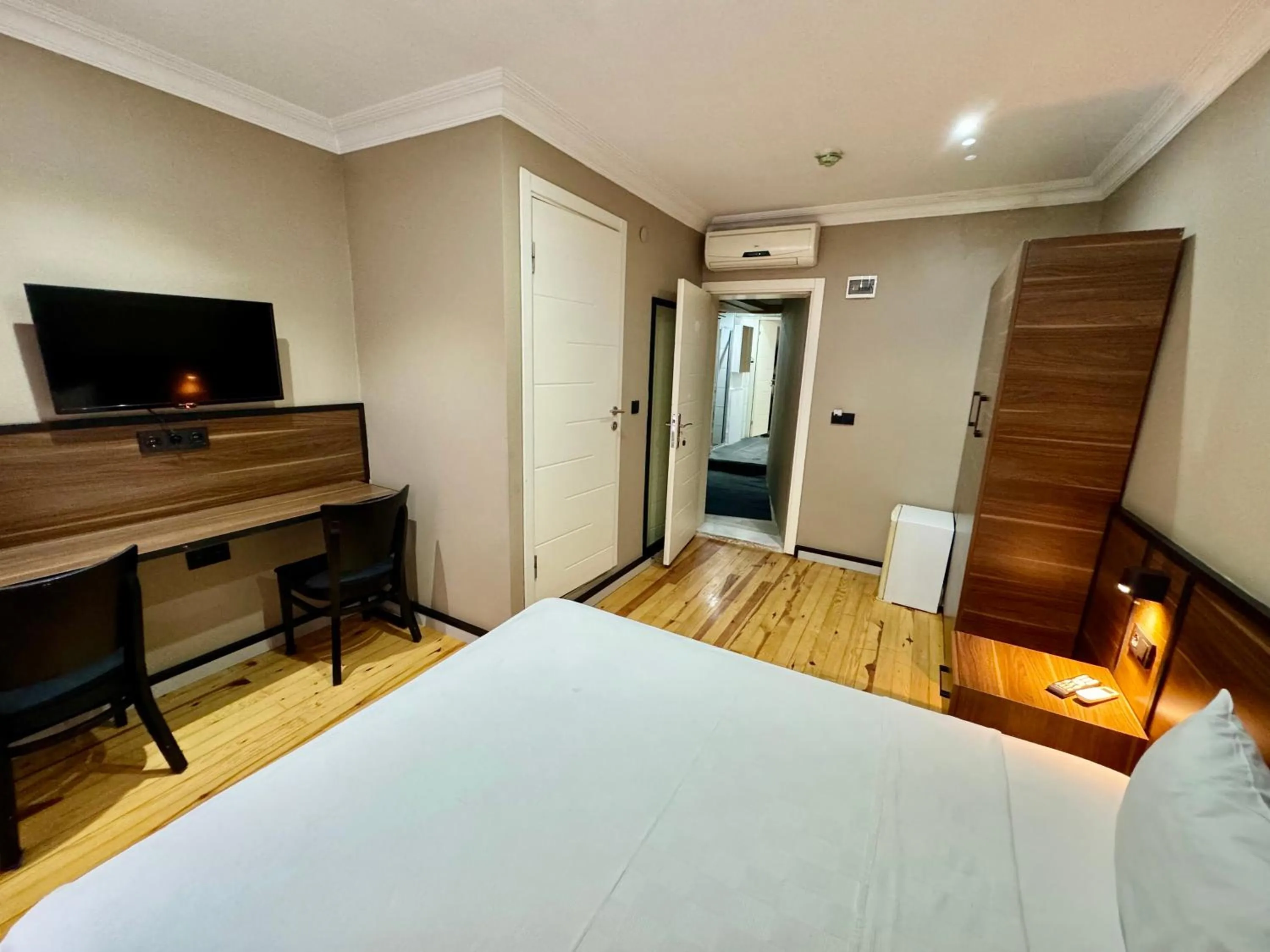 Bed in Aram Kerasi Rooms