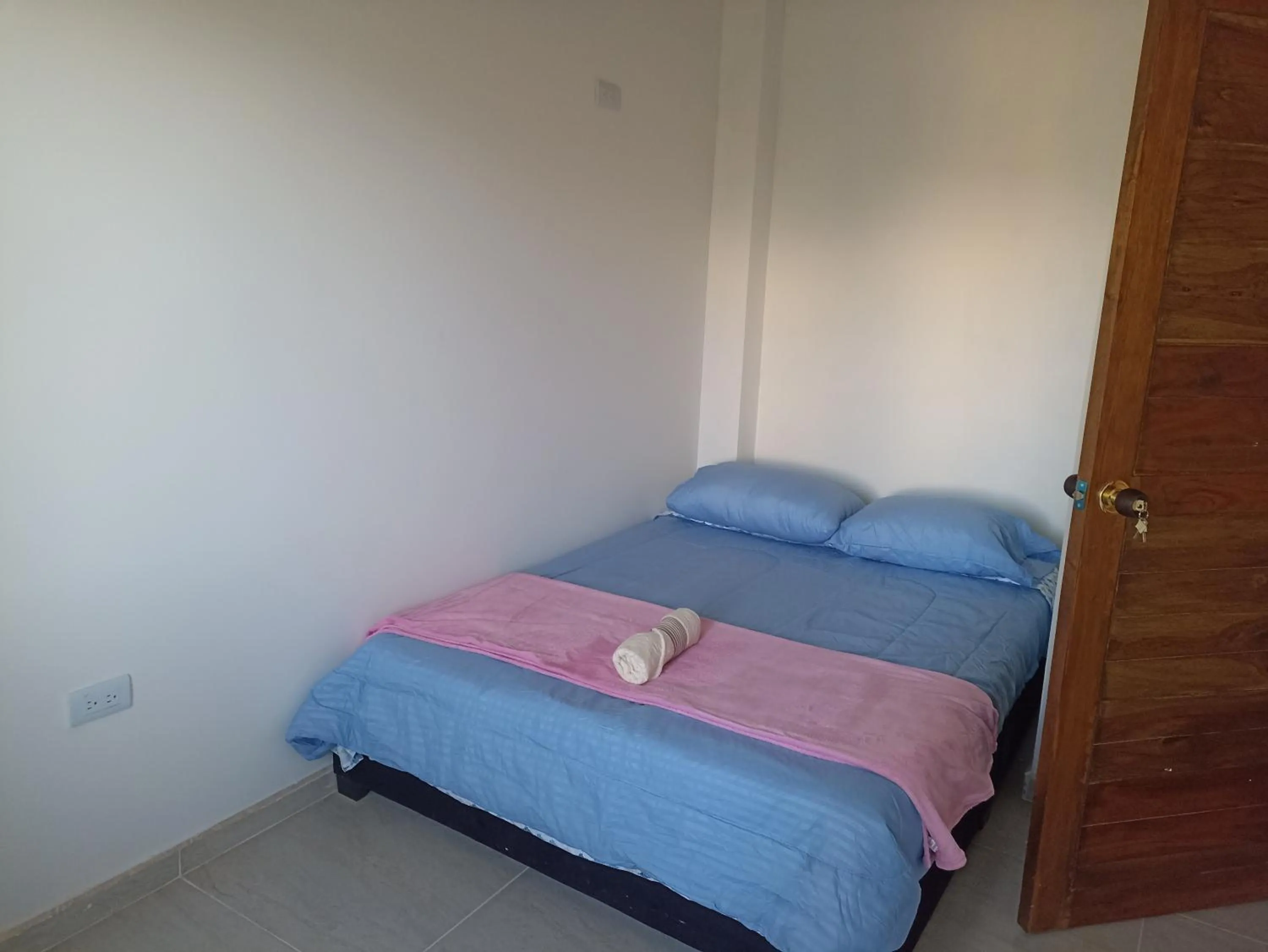 Bed in HOTEL TOTA ELISEO PLAYA BLANCA LAGO DE TOTA