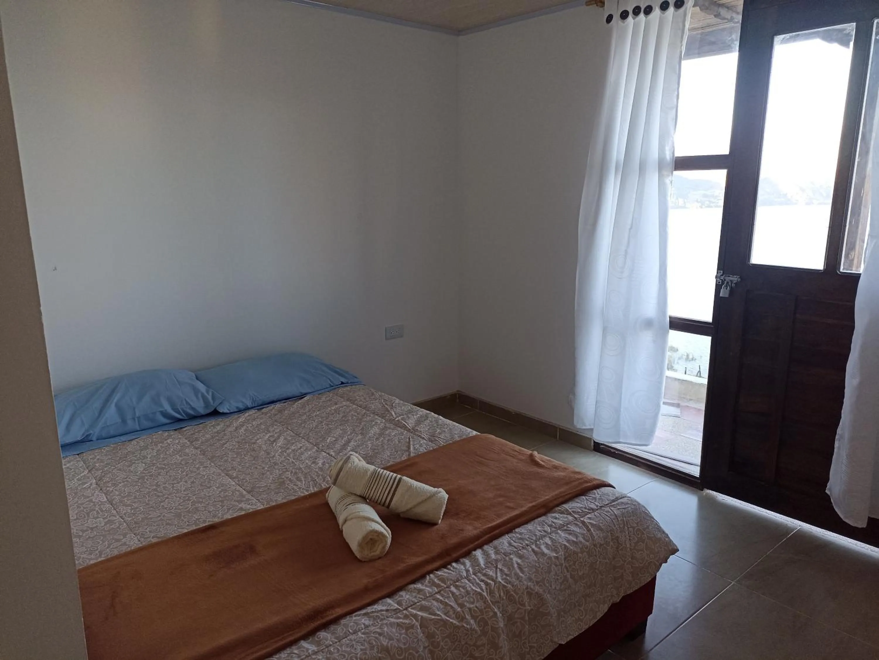 Bed in HOTEL TOTA ELISEO PLAYA BLANCA LAGO DE TOTA