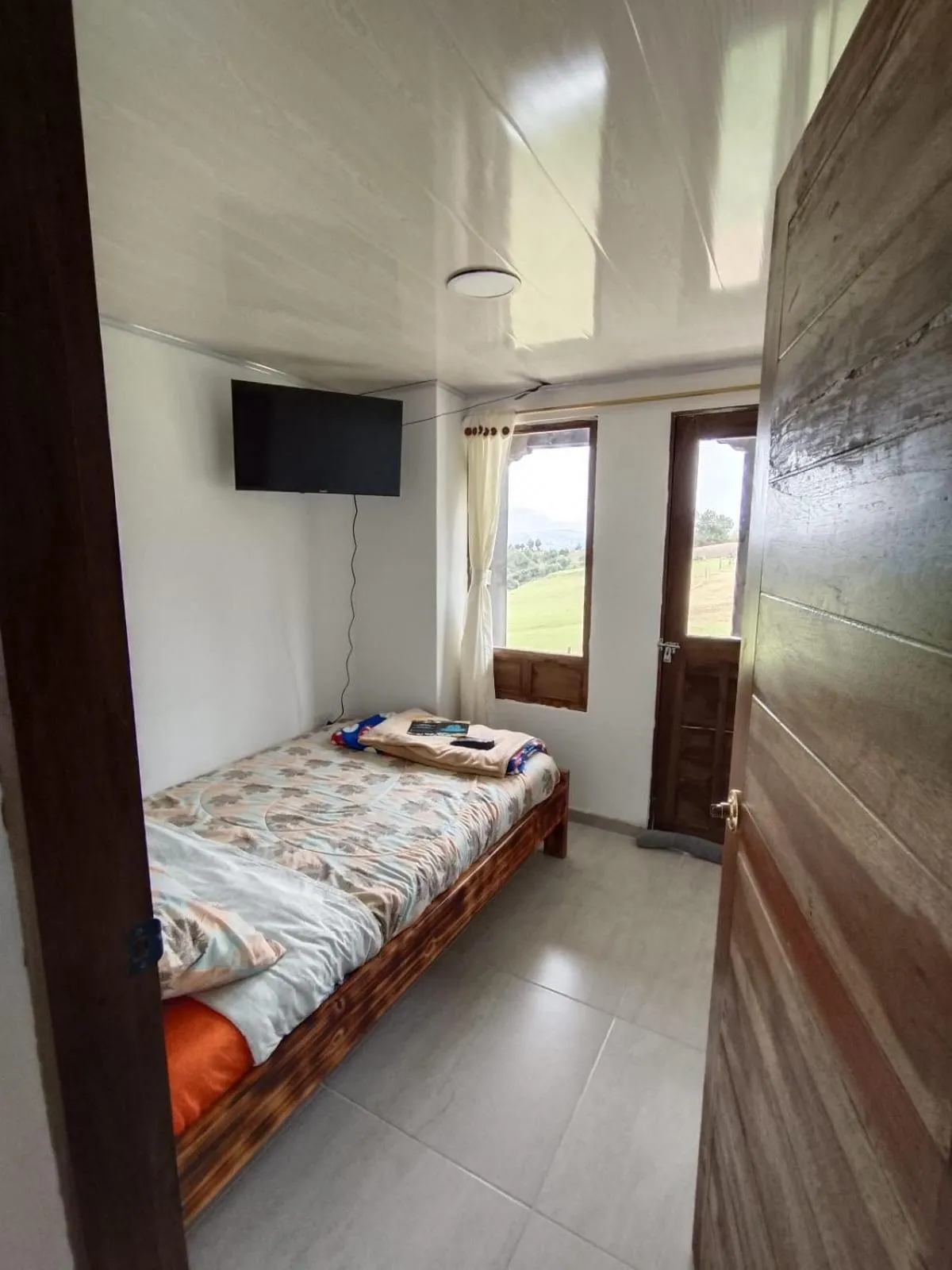 Bed in HOTEL TOTA ELISEO PLAYA BLANCA LAGO DE TOTA