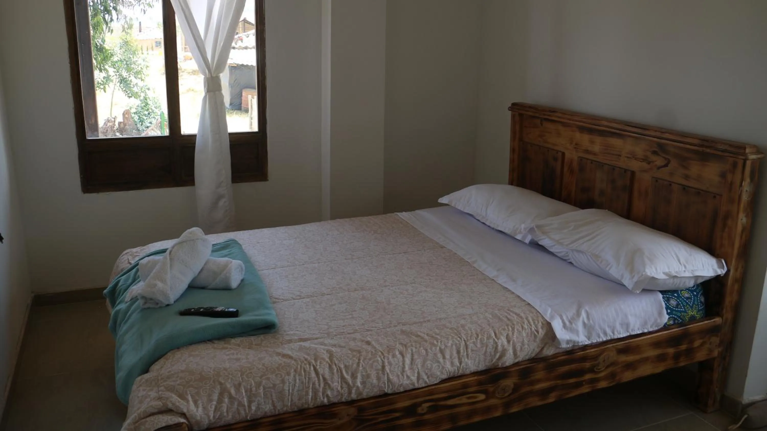 Bed in HOTEL TOTA ELISEO PLAYA BLANCA LAGO DE TOTA