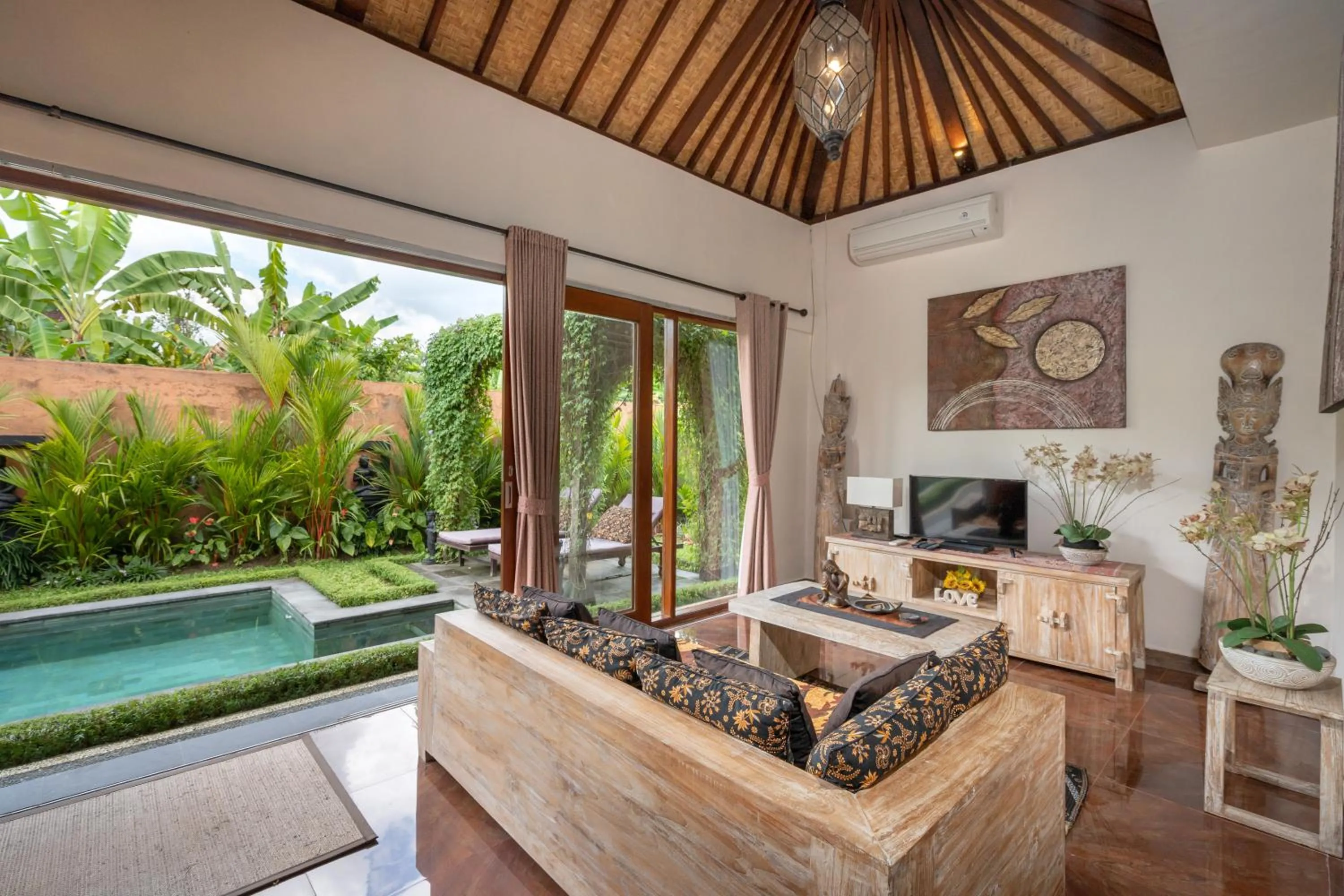 Seating area in Genie Private Villa by Travellink Bali