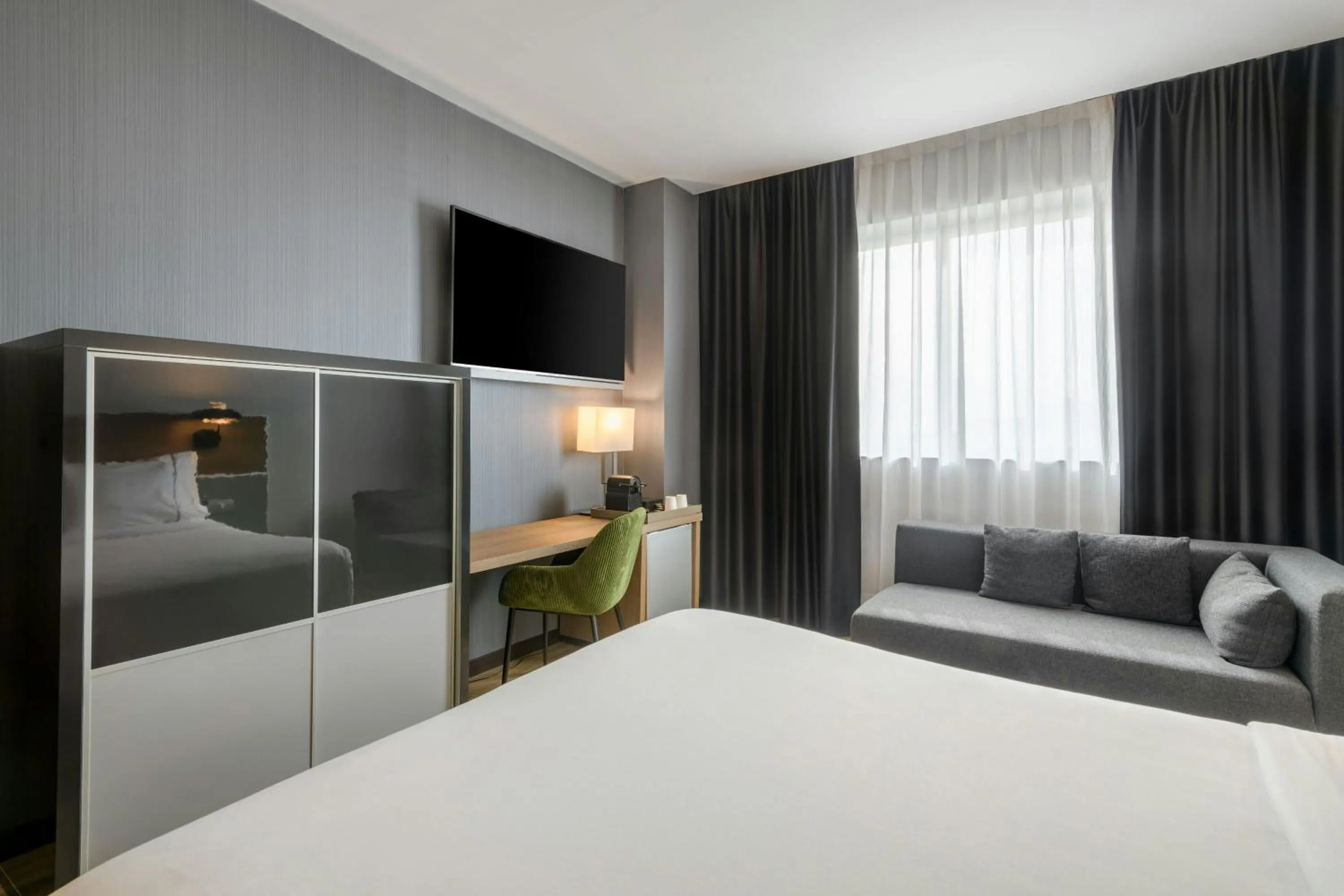 Photo of the whole room, Bed in AC Hotel Madrid Feria by Marriott