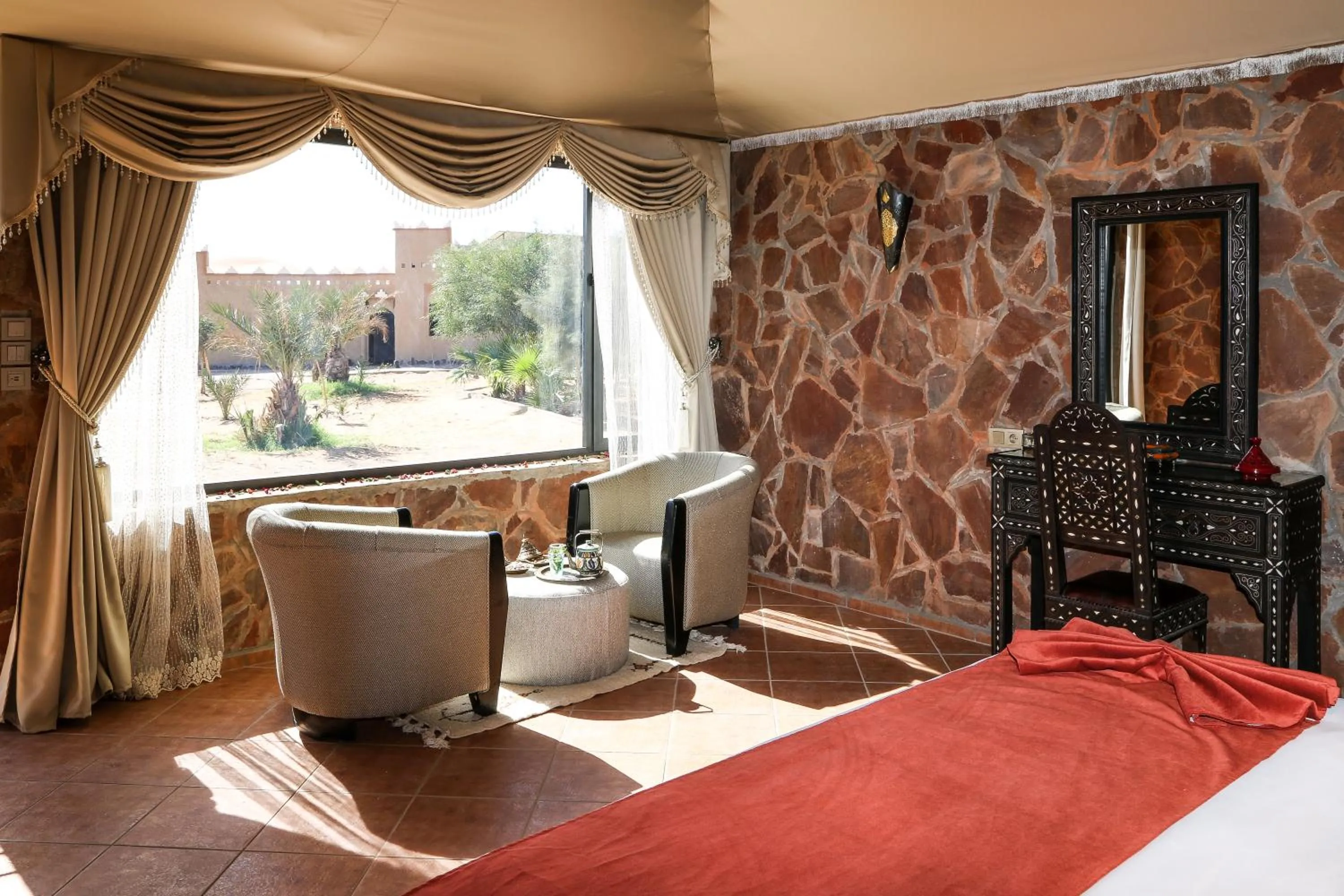 Seating area, Bed in Yakout Merzouga Luxury Camp