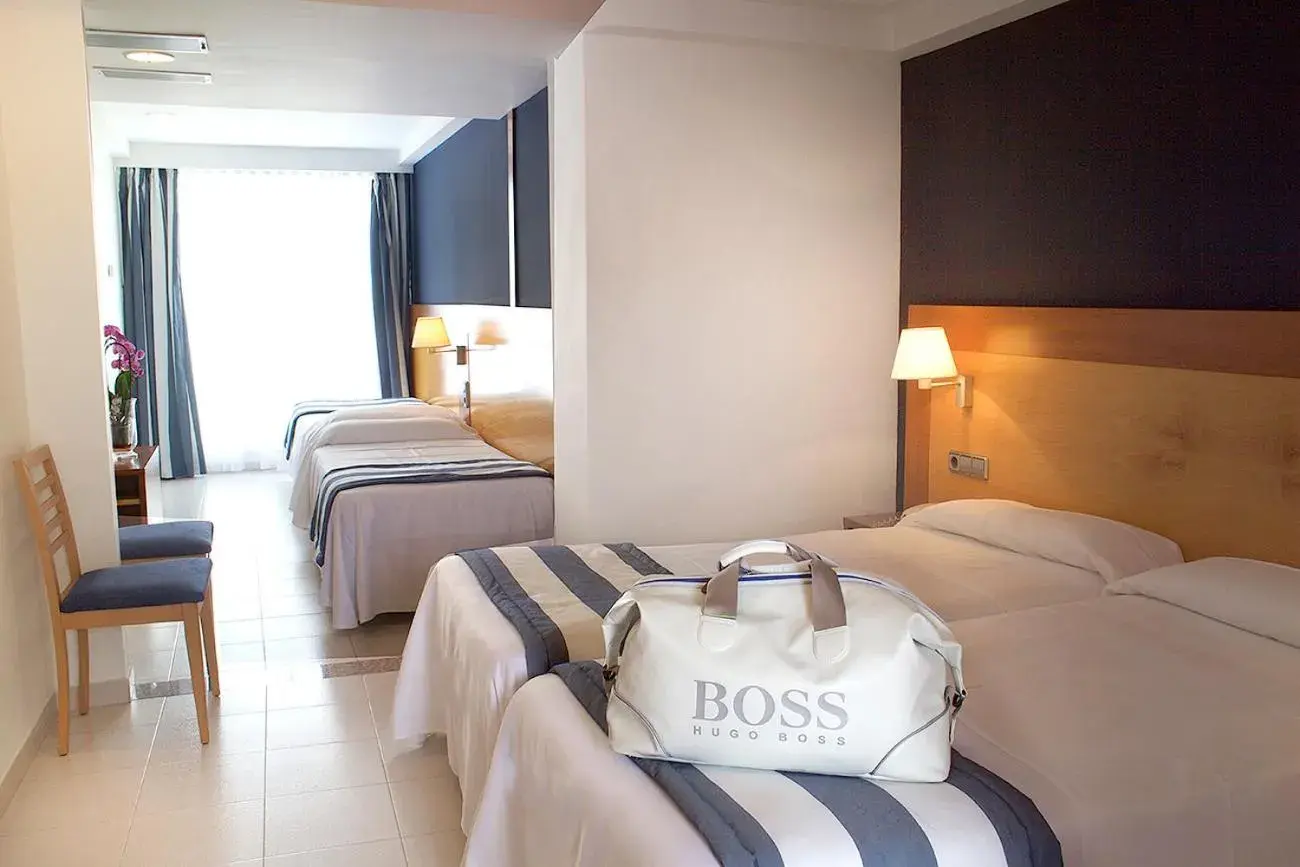 Quadruple Room with Balcony (2 Adults + 2 Children) in Hotel Els Pins Quadruple Room with Balcony (2 Adults + 2 Children) in Hotel Els Pins