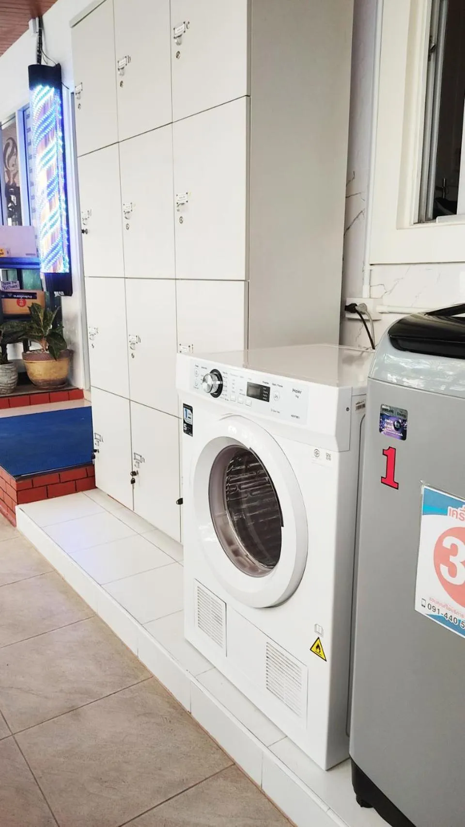 washing machine in 66 Apartment