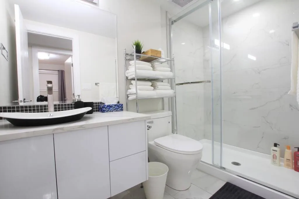 Shower in Executive Bsmt Suite, King Bed, 5 min to DT & Whyte Ave, Sleeps 6!