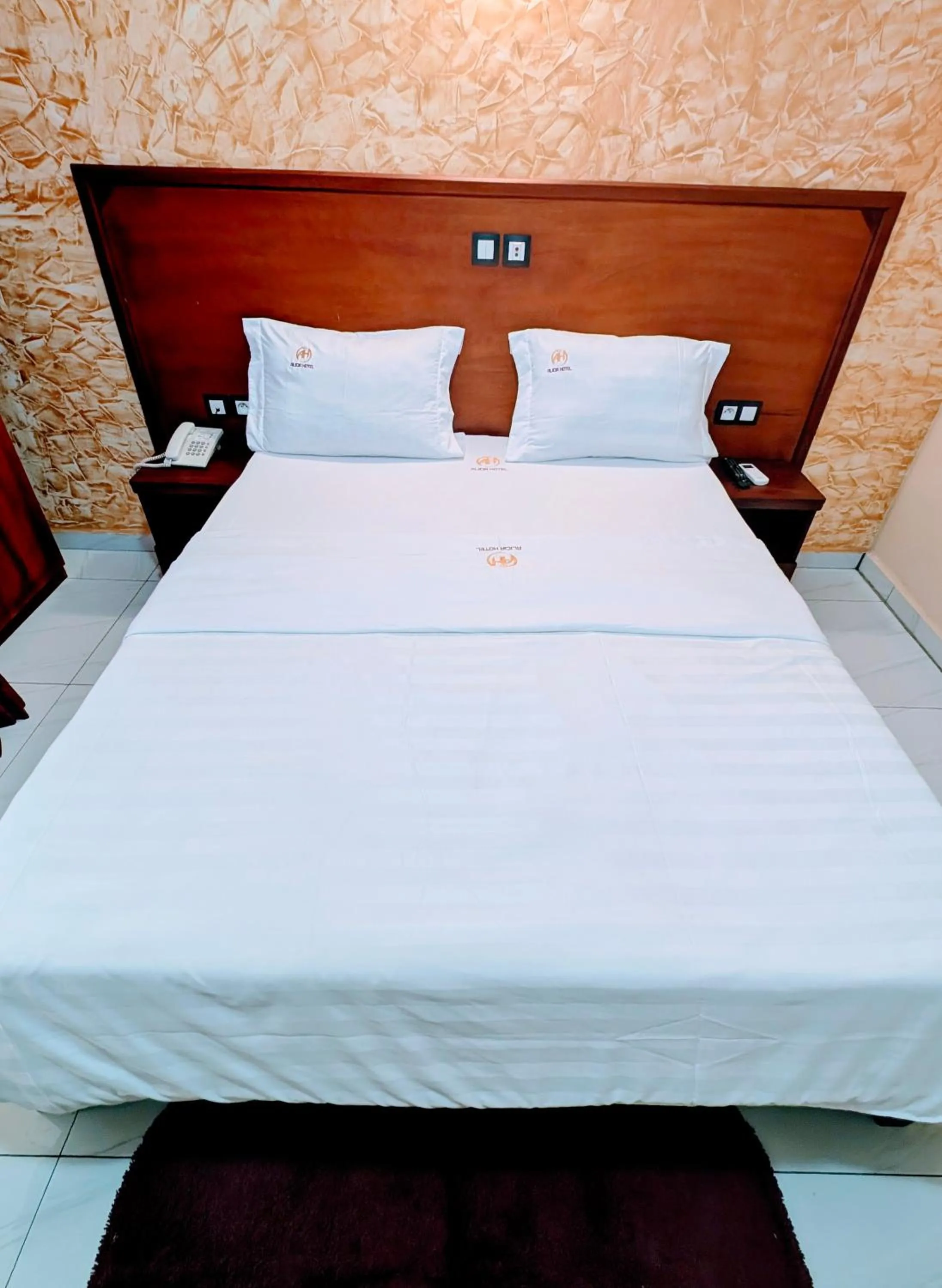 Bed in ALICIA HOTEL