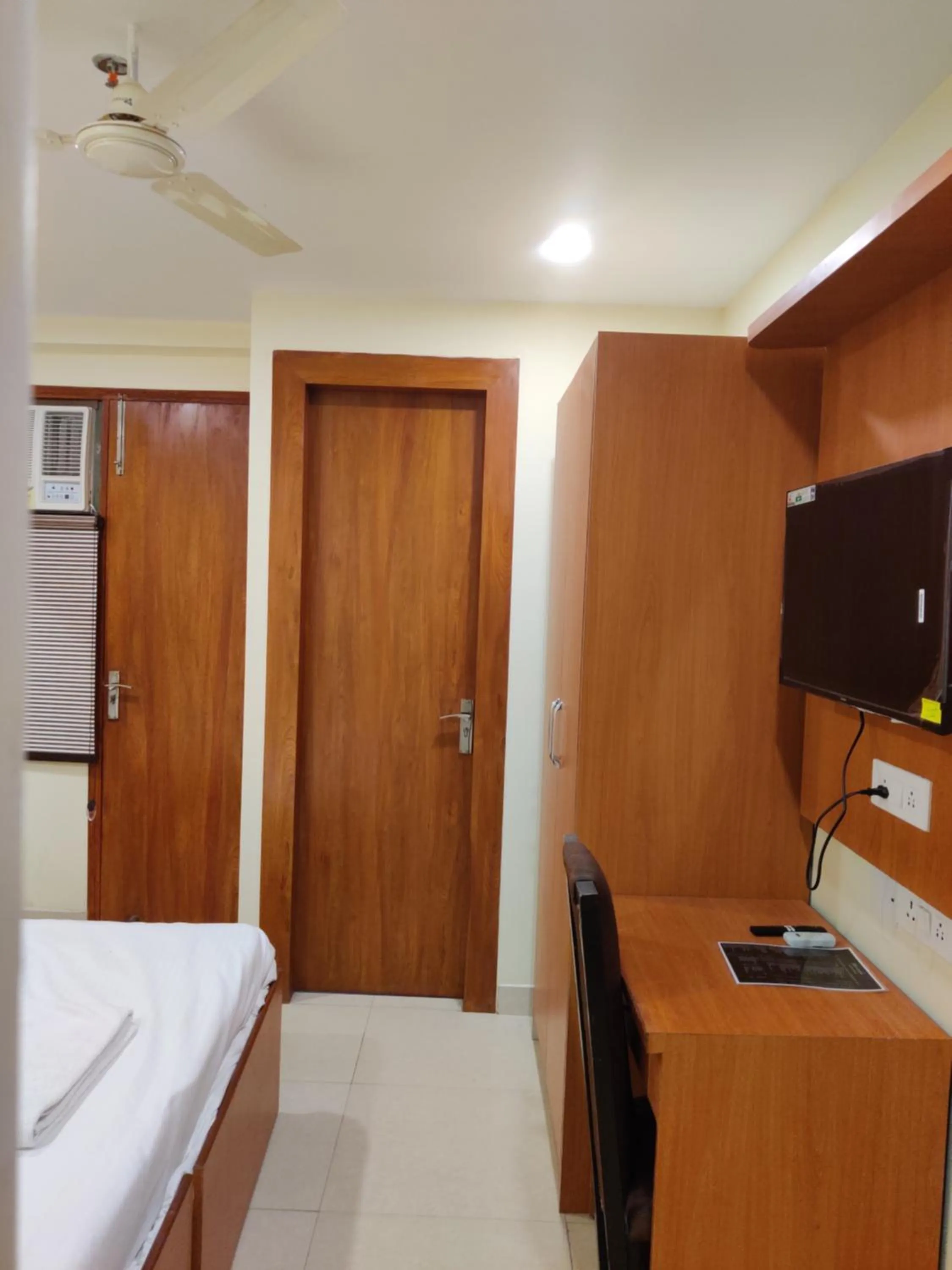 Bed in Hotel TMS Grand