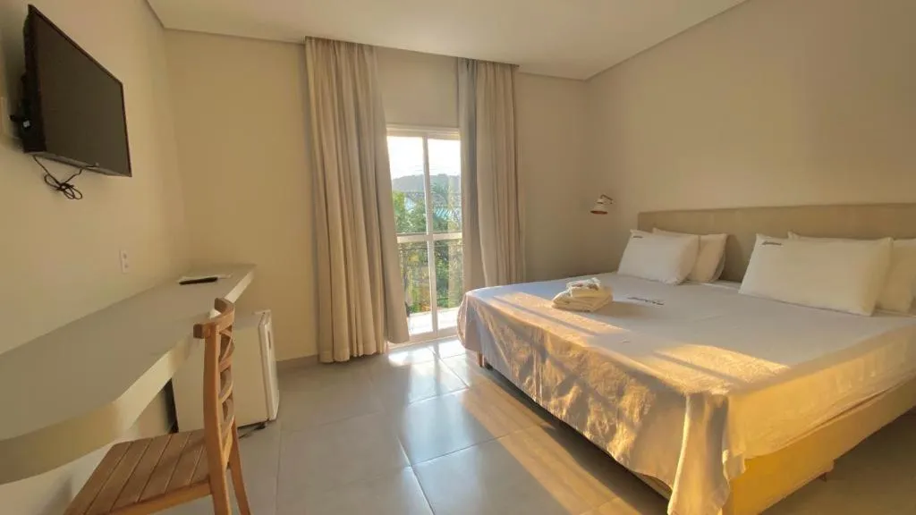 Photo of the whole room, Bed in Pousada Aquino Mar