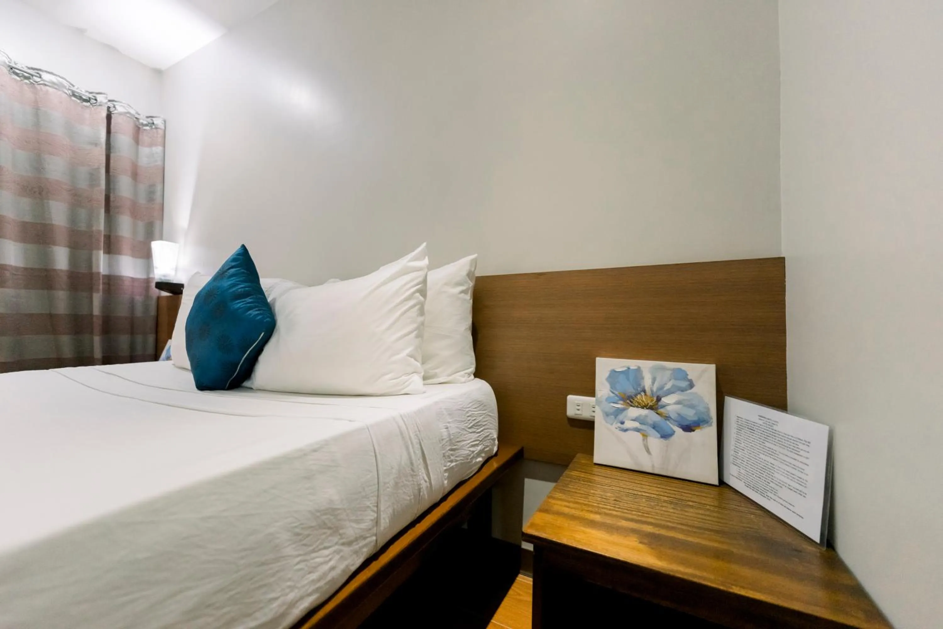 Bed in Madonna Hometel and Suites