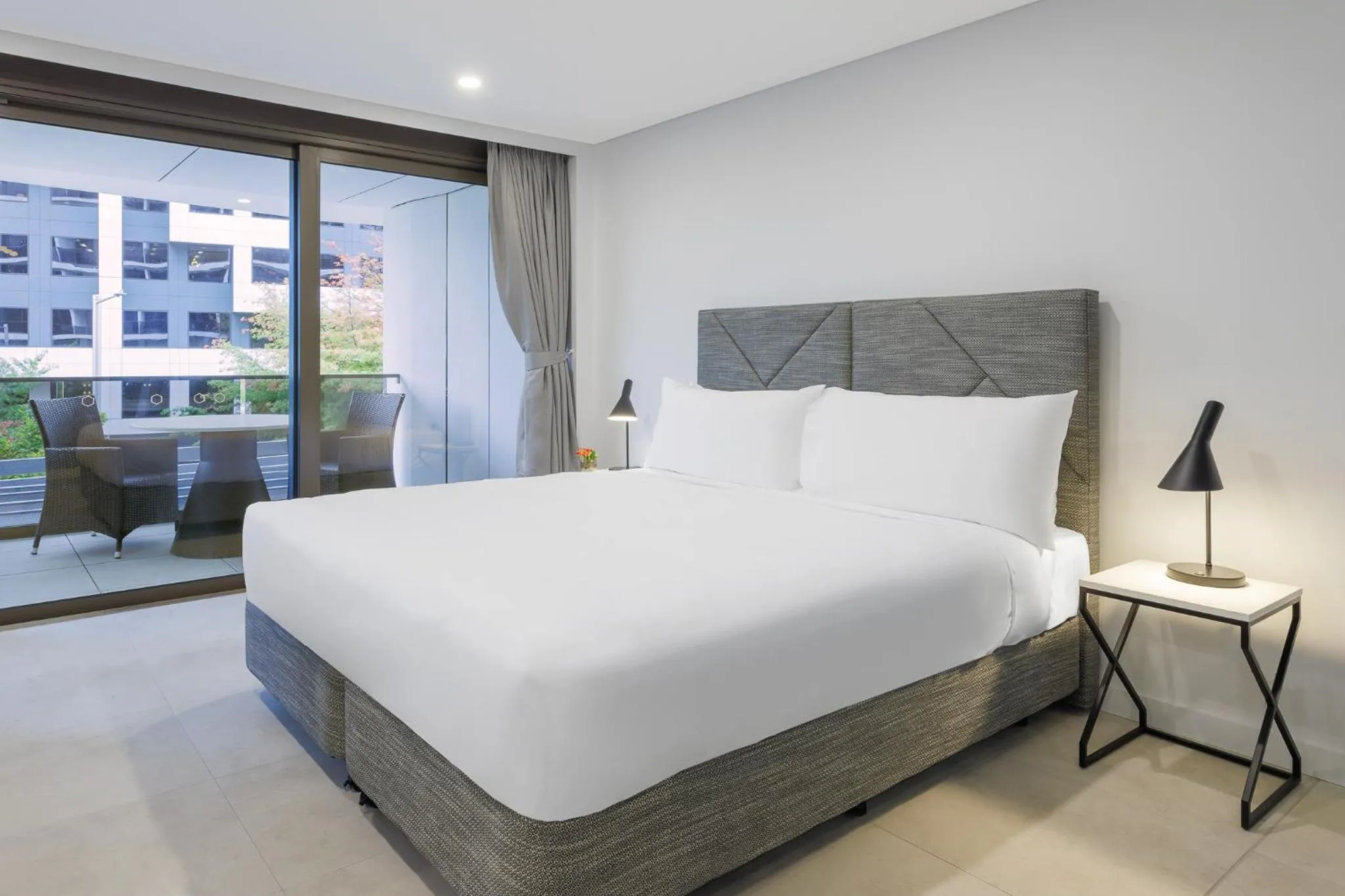 Bed in Meriton Suites Canberra