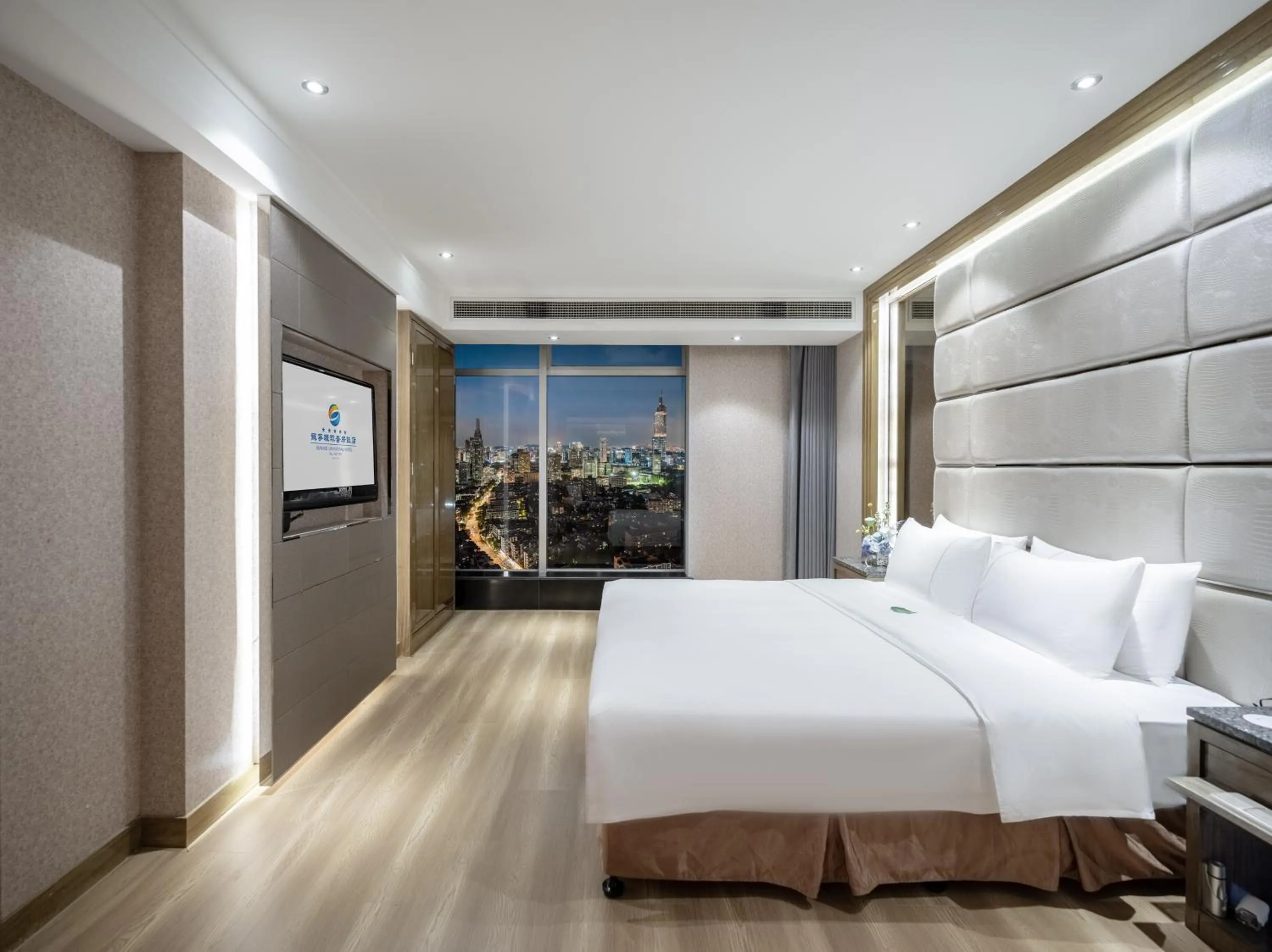 Bed in Suning Universal Hotel ALL-SUITES