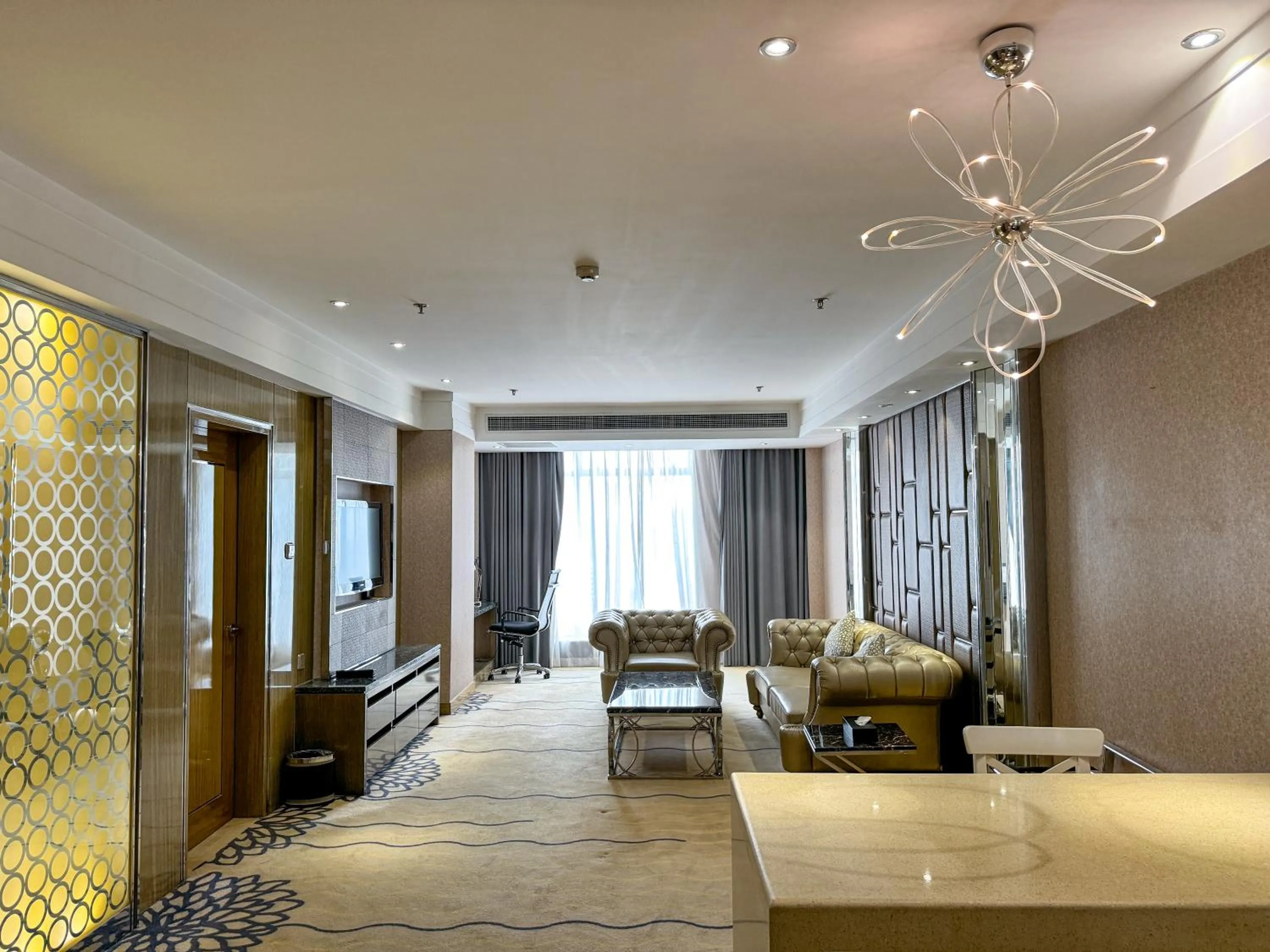 Living room in Suning Universal Hotel ALL-SUITES
