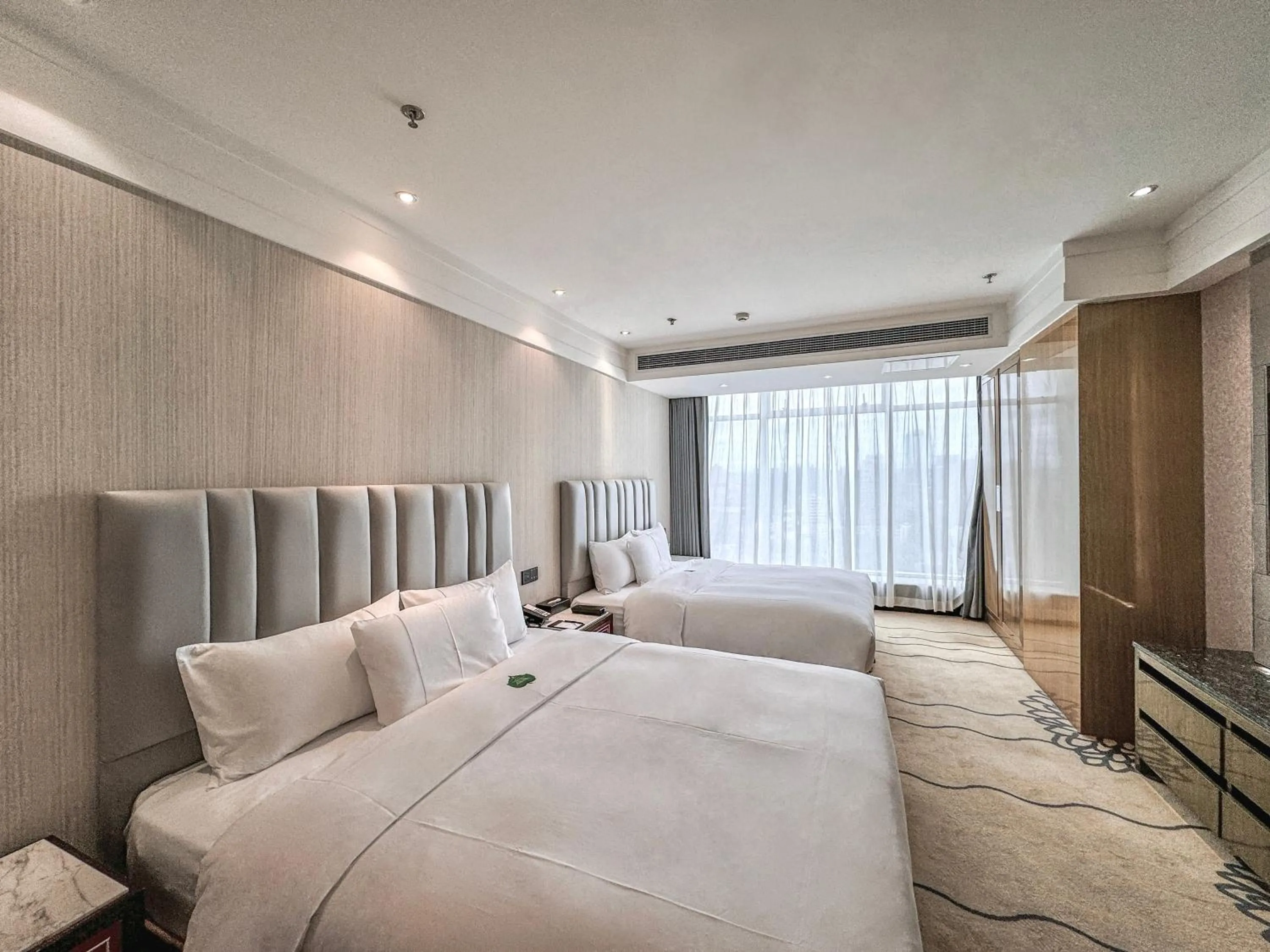 Bed in Suning Universal Hotel ALL-SUITES