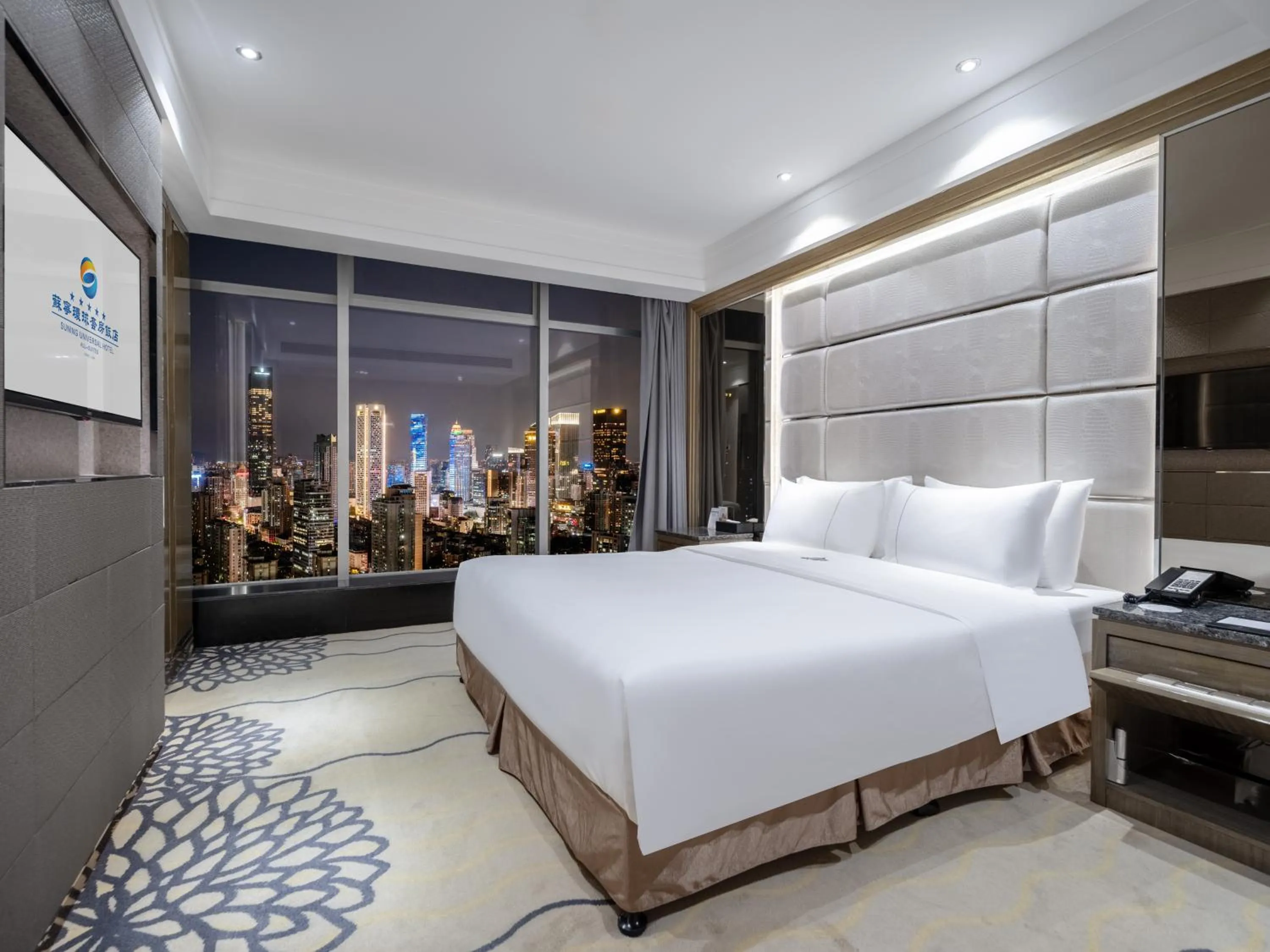 Bed in Suning Universal Hotel ALL-SUITES