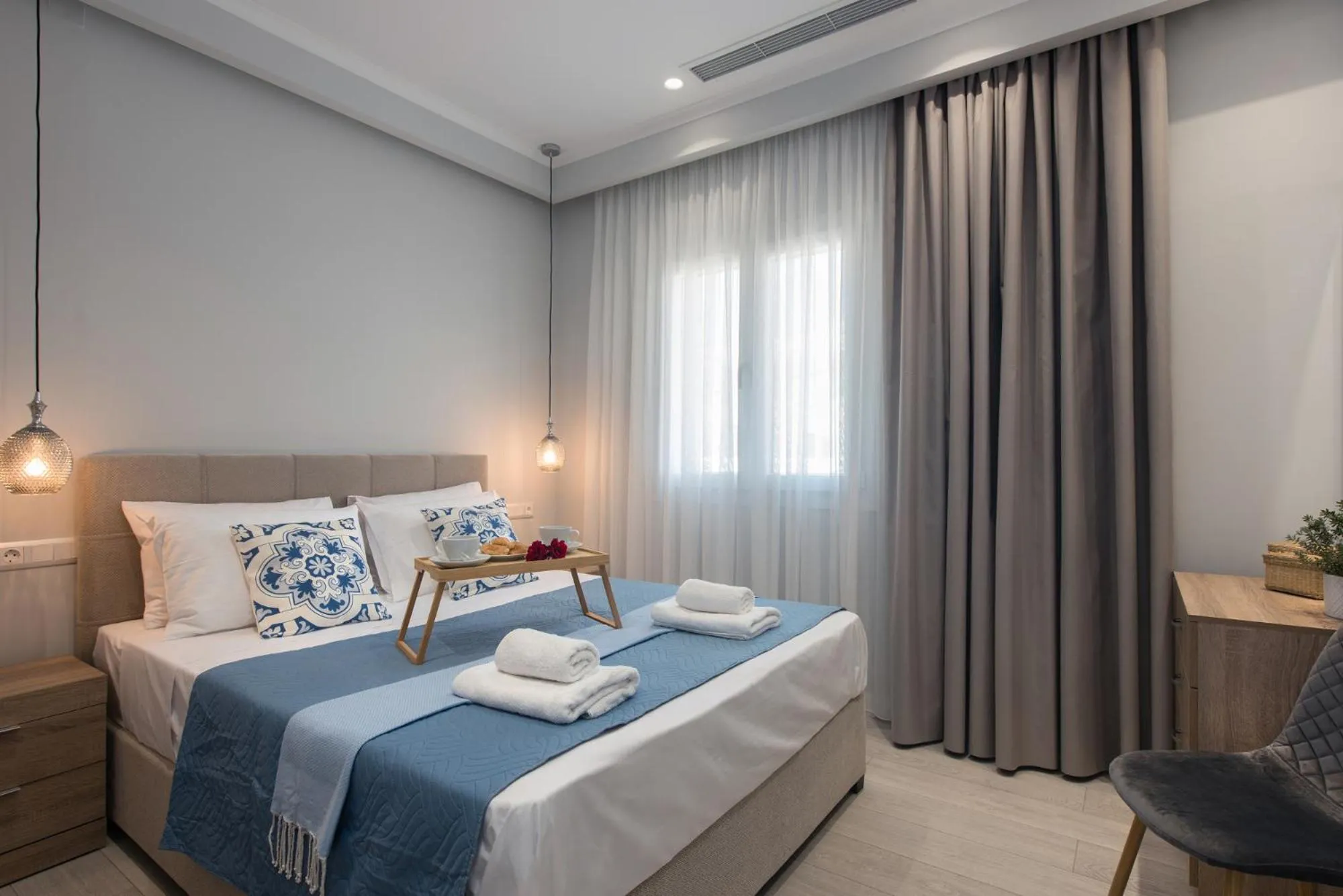 Bed in Pelagia Apartment by Kormaris